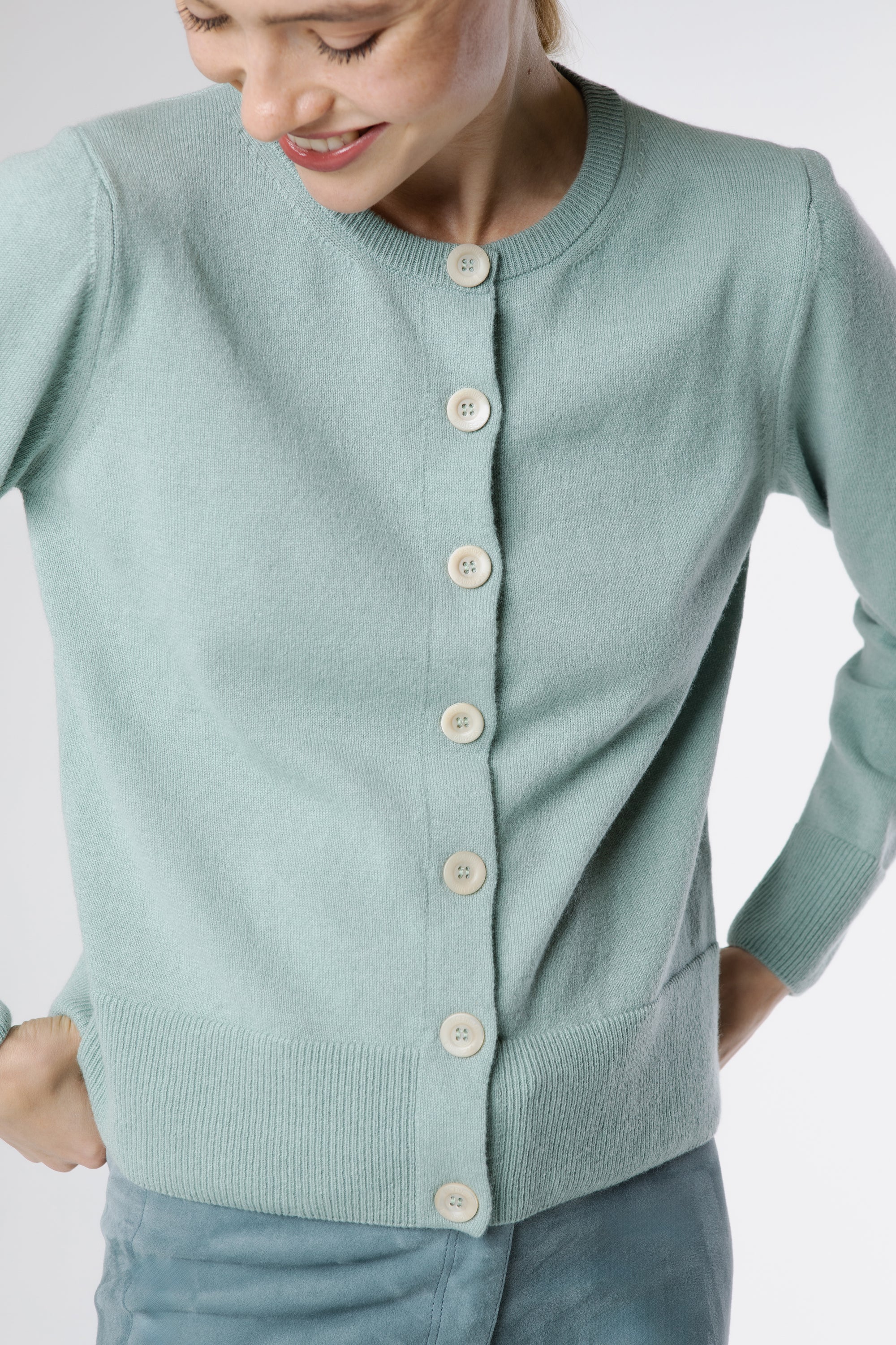 Soft Italian cashmere detail – close up of Ginan Cashmere Cardigan Dew round neckline, fine knit texture and tonal buttons.