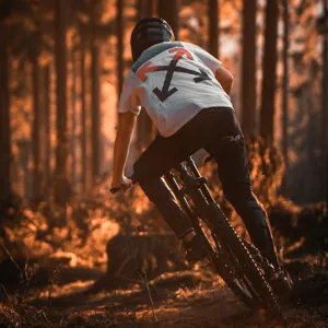 Adventurer E-biking through forest trail at sunset – Extra Activities Tarifa