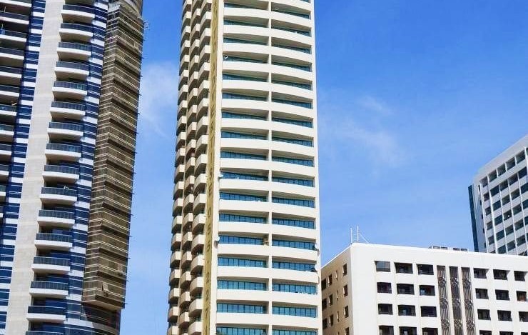 Skyline view featuring the White Swan Building, highlighting prime location and real estate investment potential.