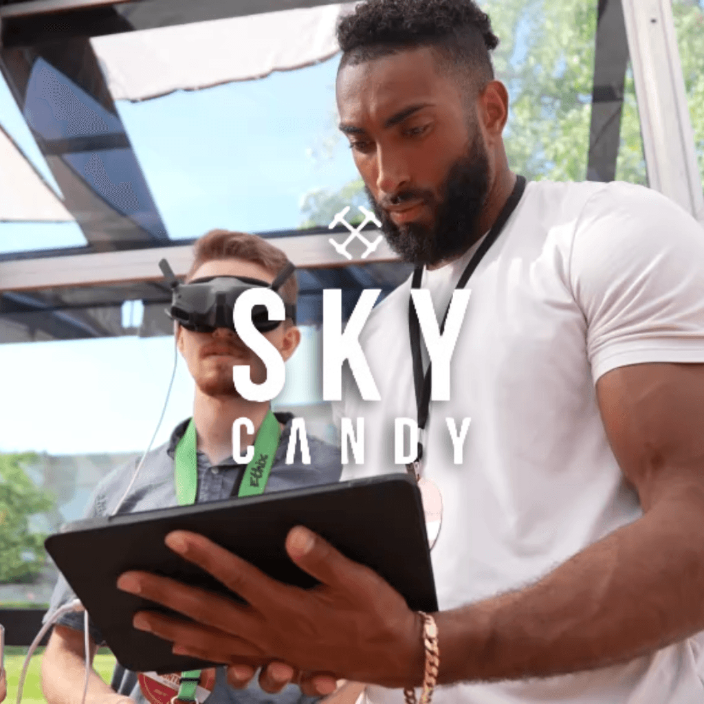 Videographer filming drone and FPV content at Sky Candy Studios production setup.