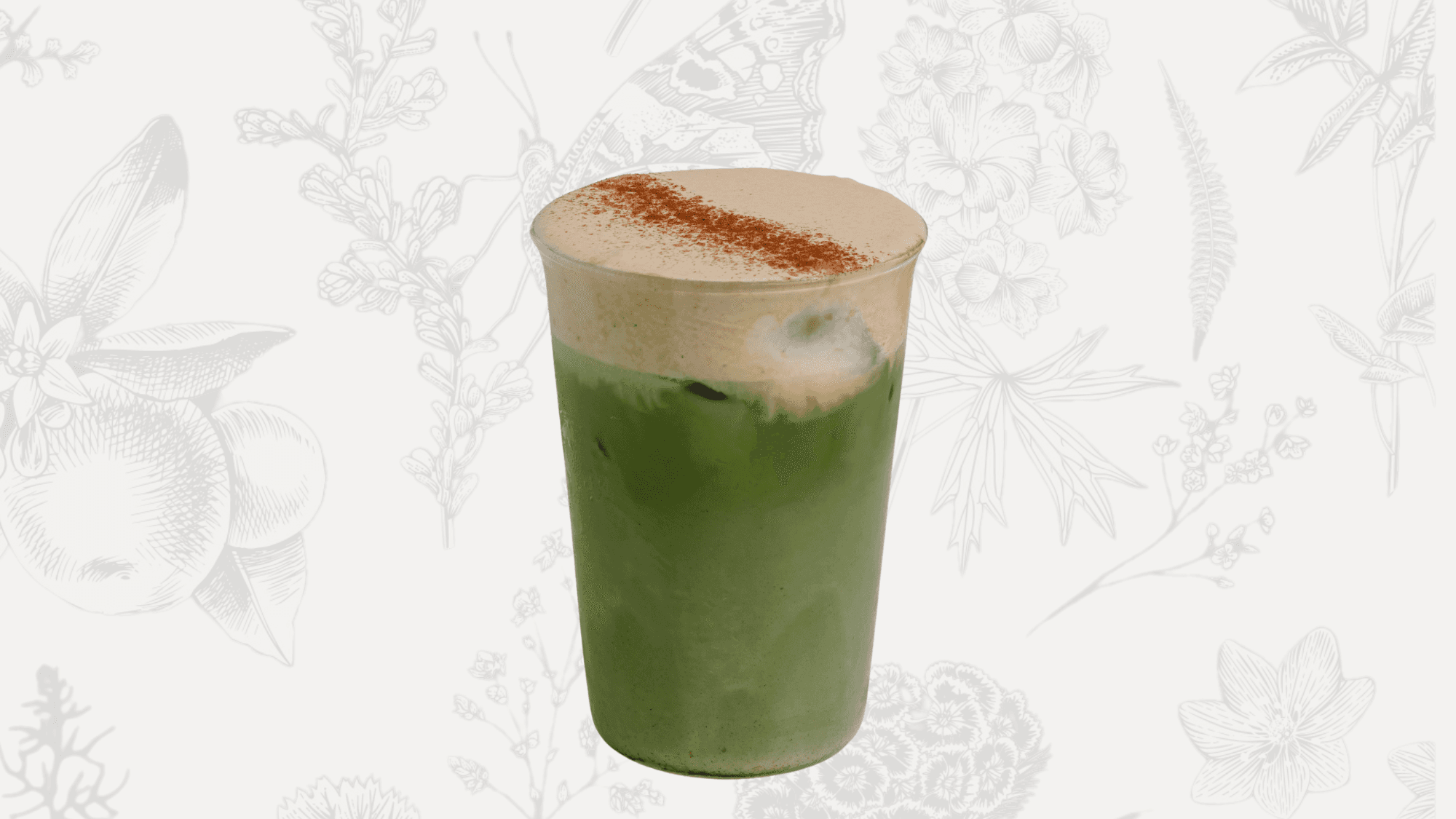 Iced double pumpkin matcha latte with pumpkin syrup, whole milk, pumpkin cheese foam, and a sprinkle of pumpkin spice.