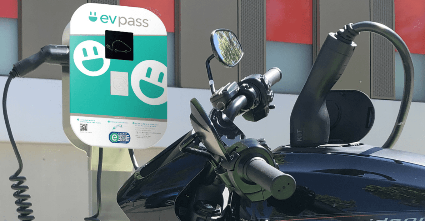 Electric motorcycle charging at an evpass charging station, showcasing the use of electric vehicle charging infrastructure for two-wheelers and promoting sustainable mobility solutions in Switzerland