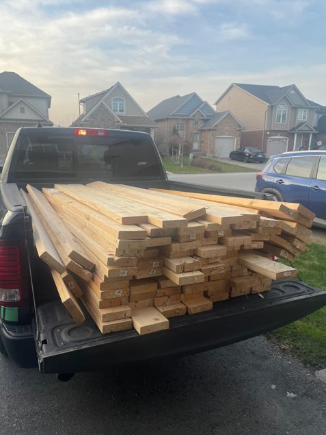 Bulldog truck with wooden logs on the back