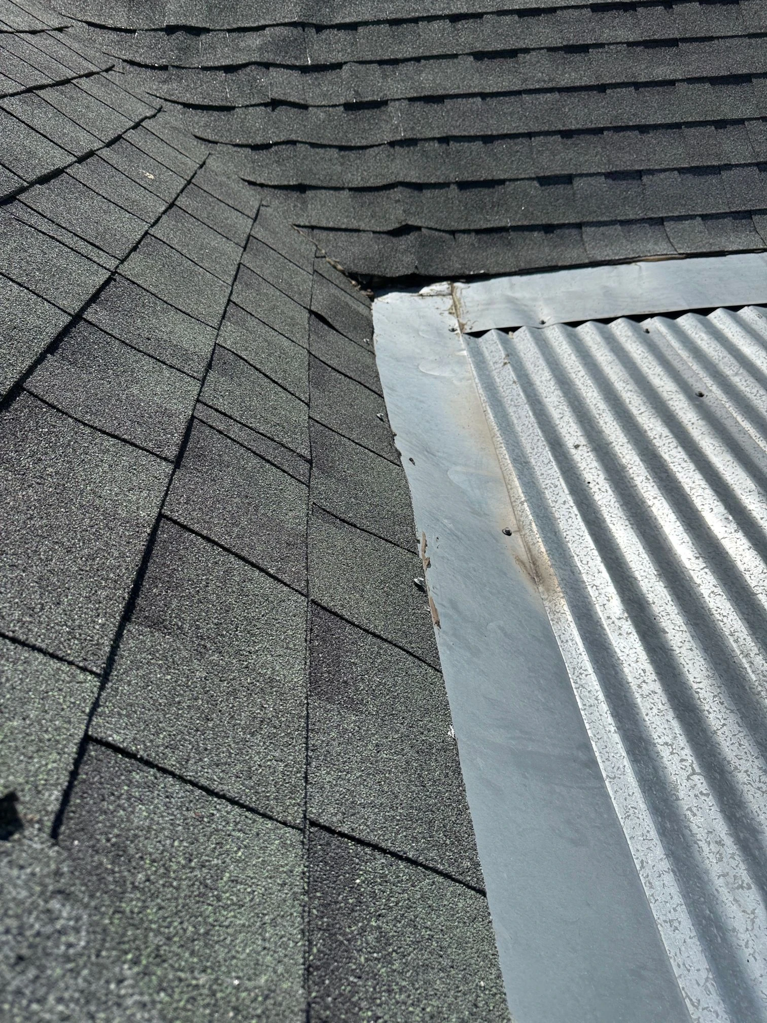 Before repair: low-slope roof transition rebuilt in San Antonio, Texas.