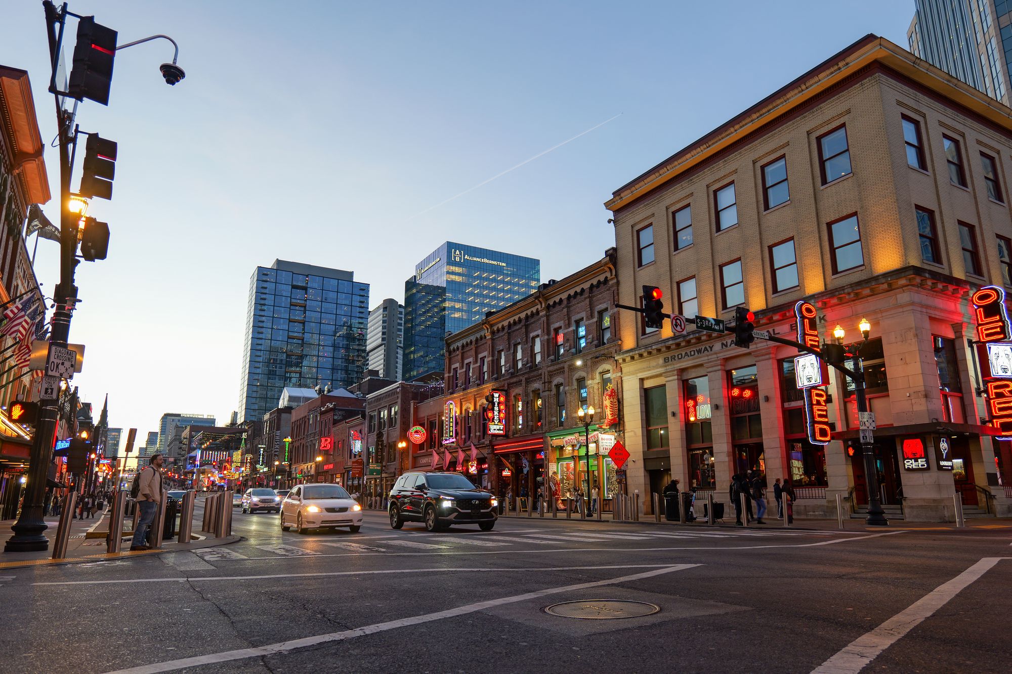 Nashville's Broadway district at dusk with music venues and restaurants