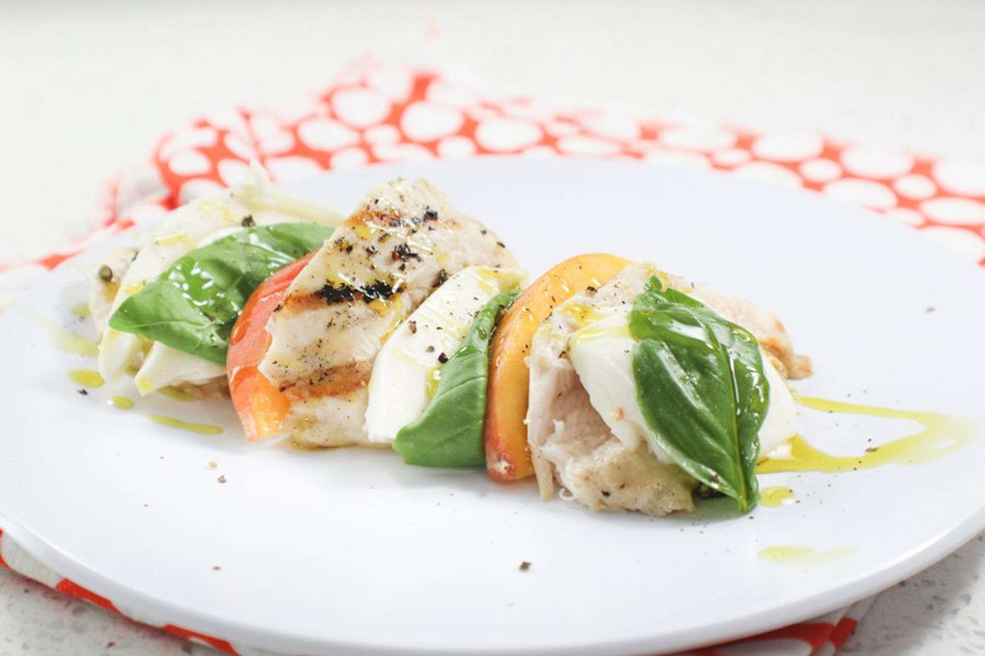 served grilled chicken peach caprese