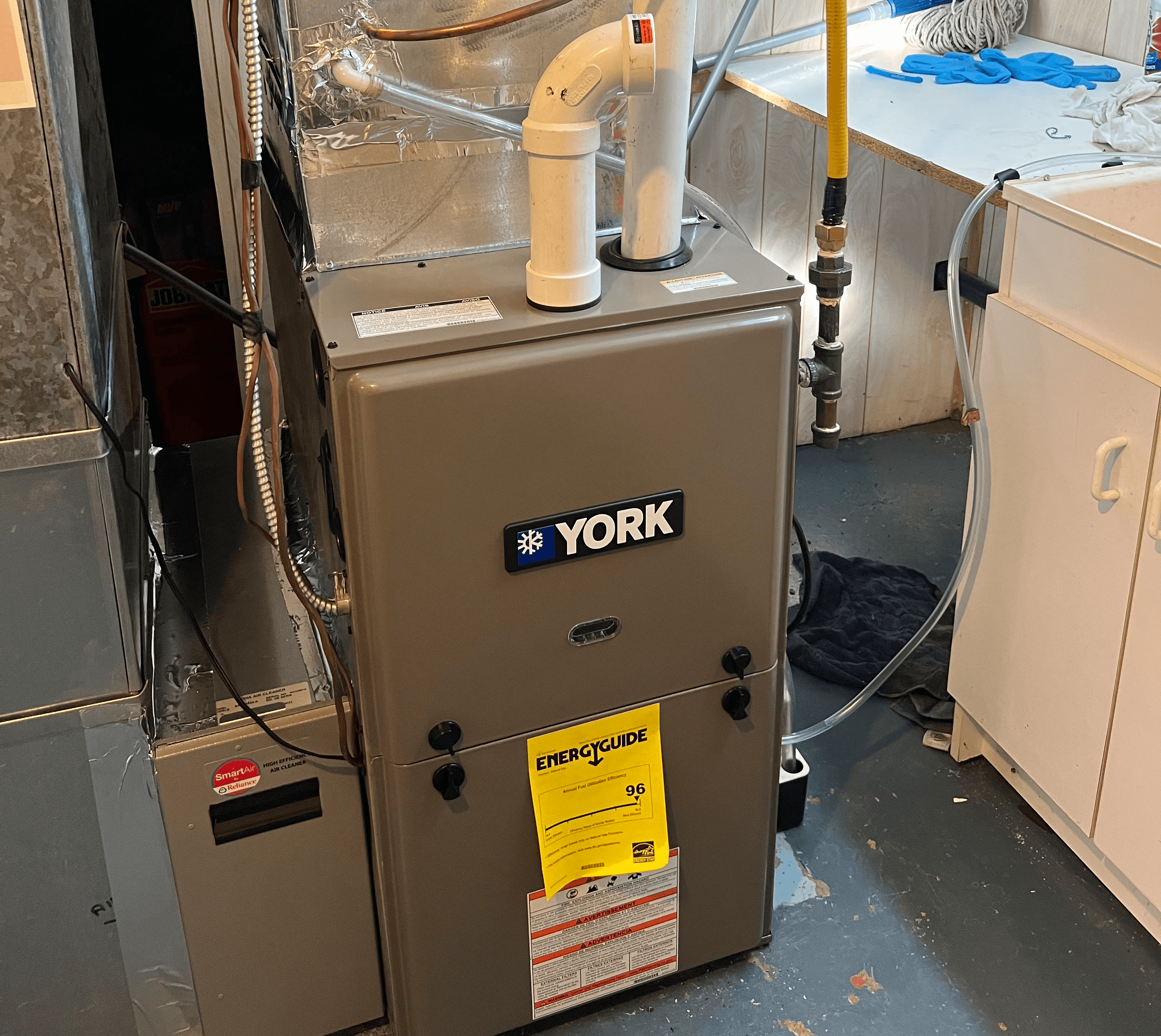 Furnace repair work being performed on a residential heating system in Mississauga