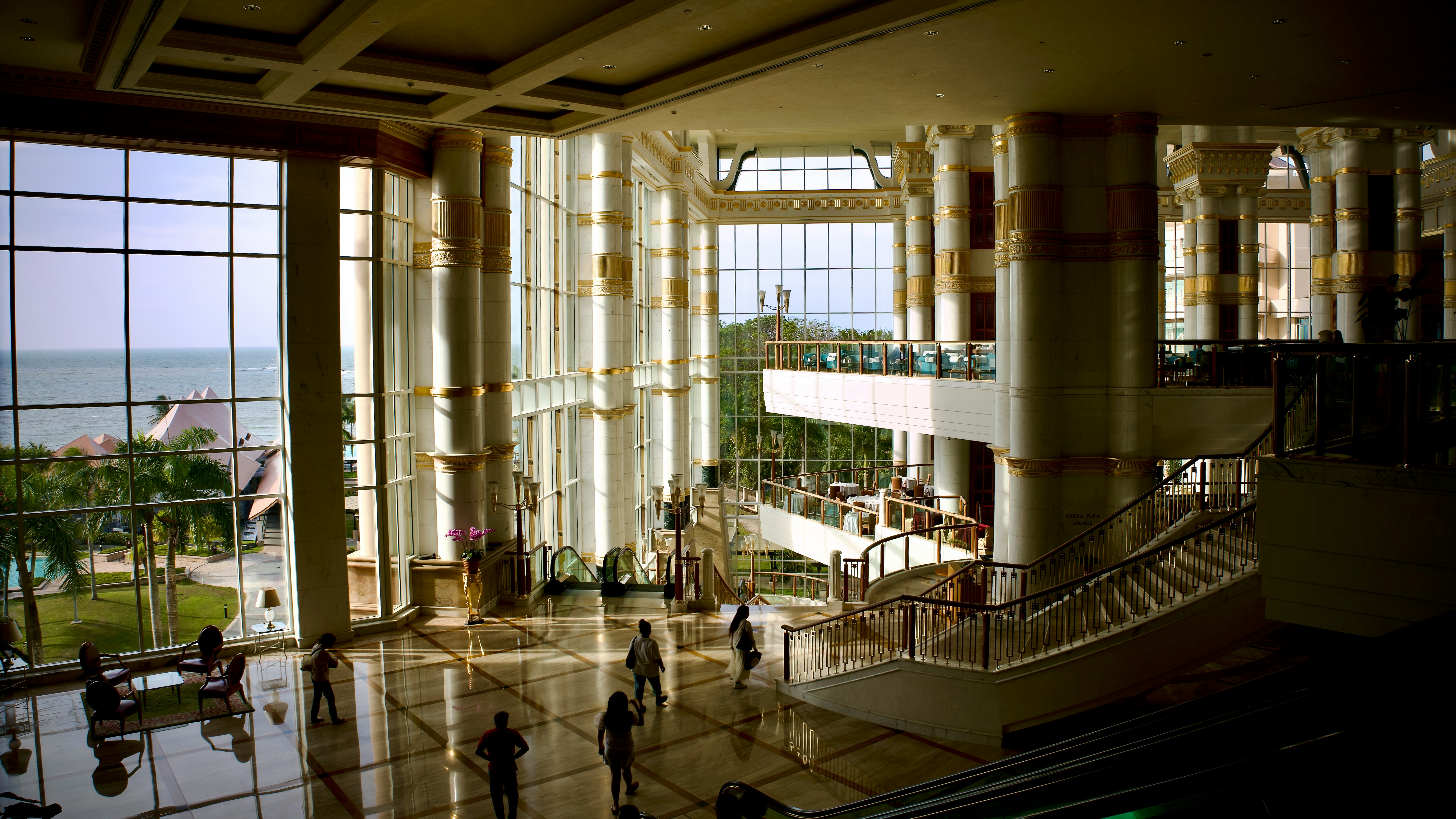 a group of people standing in a large building