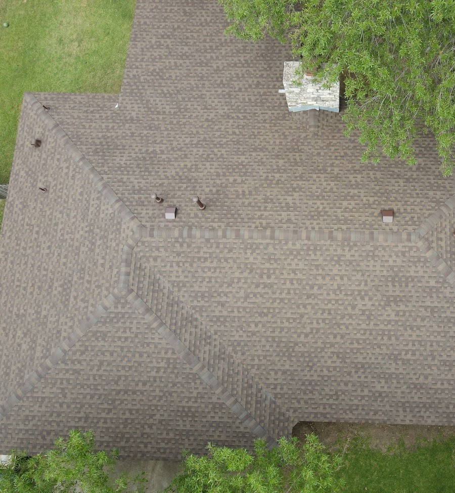 Hip roof with architectural shingles and slant-back vents, providing a stylish design with enhanced attic ventilation.