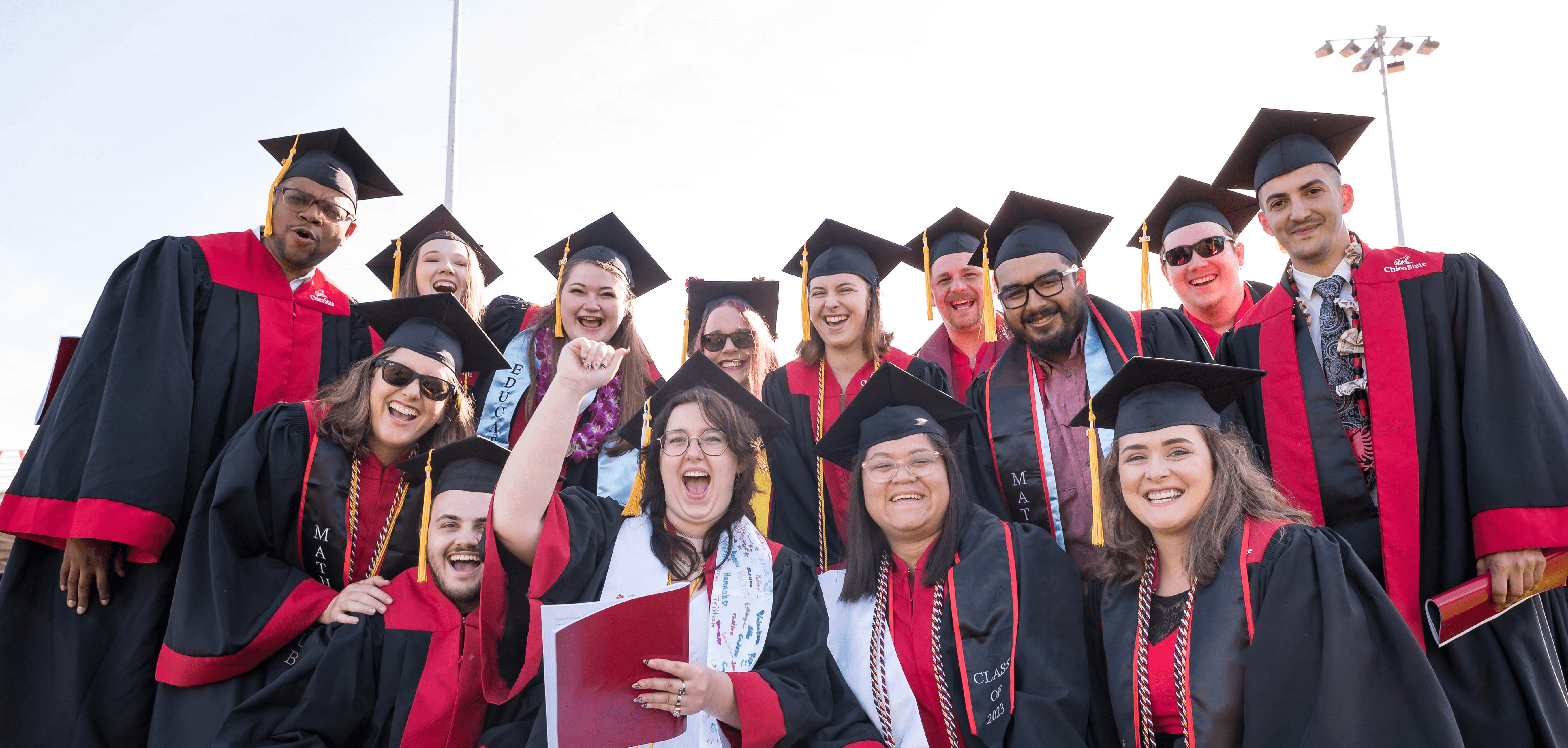 Smiling student in caps and gowns