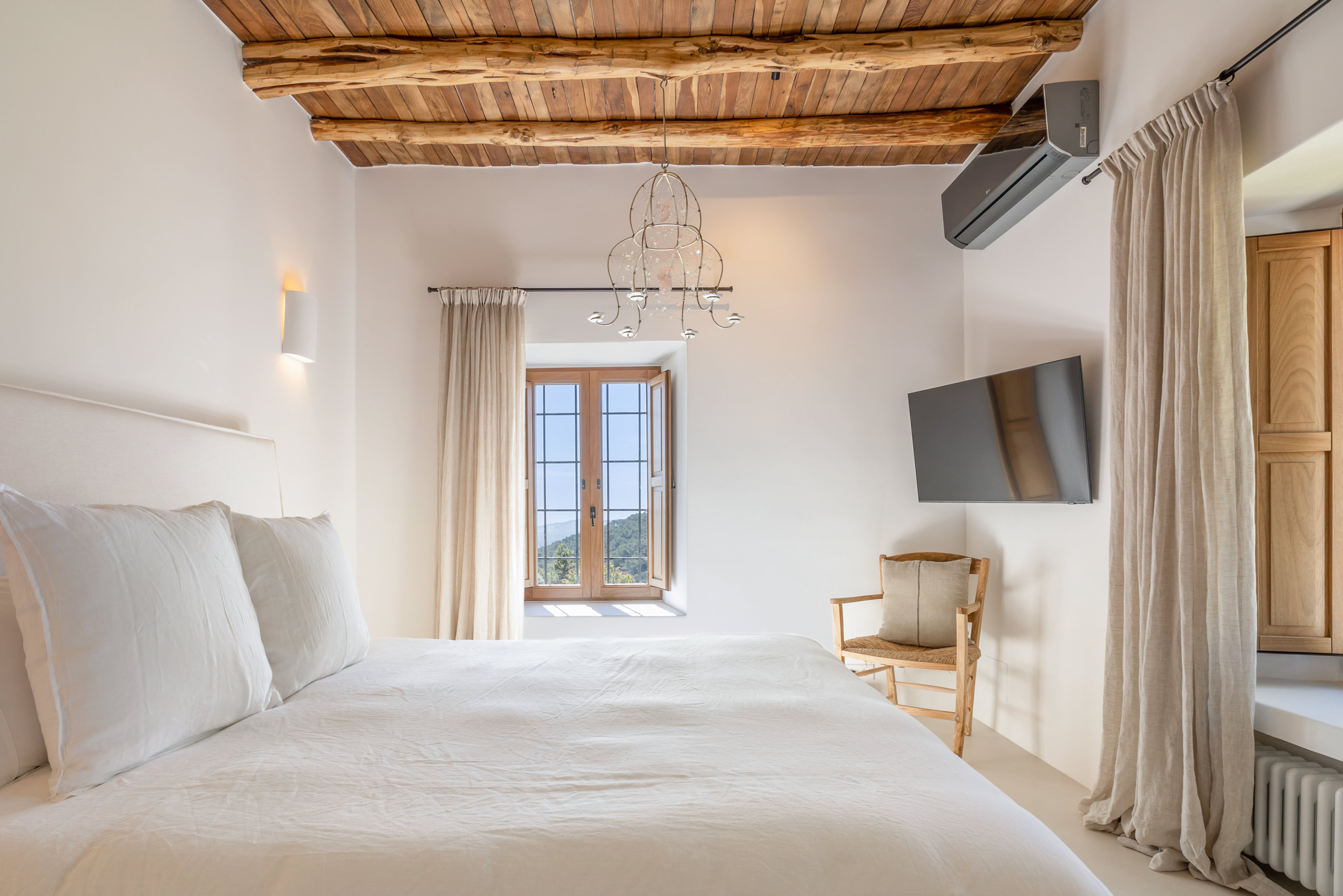 Ensuite Bedroom with Smart TV and Mountain Views