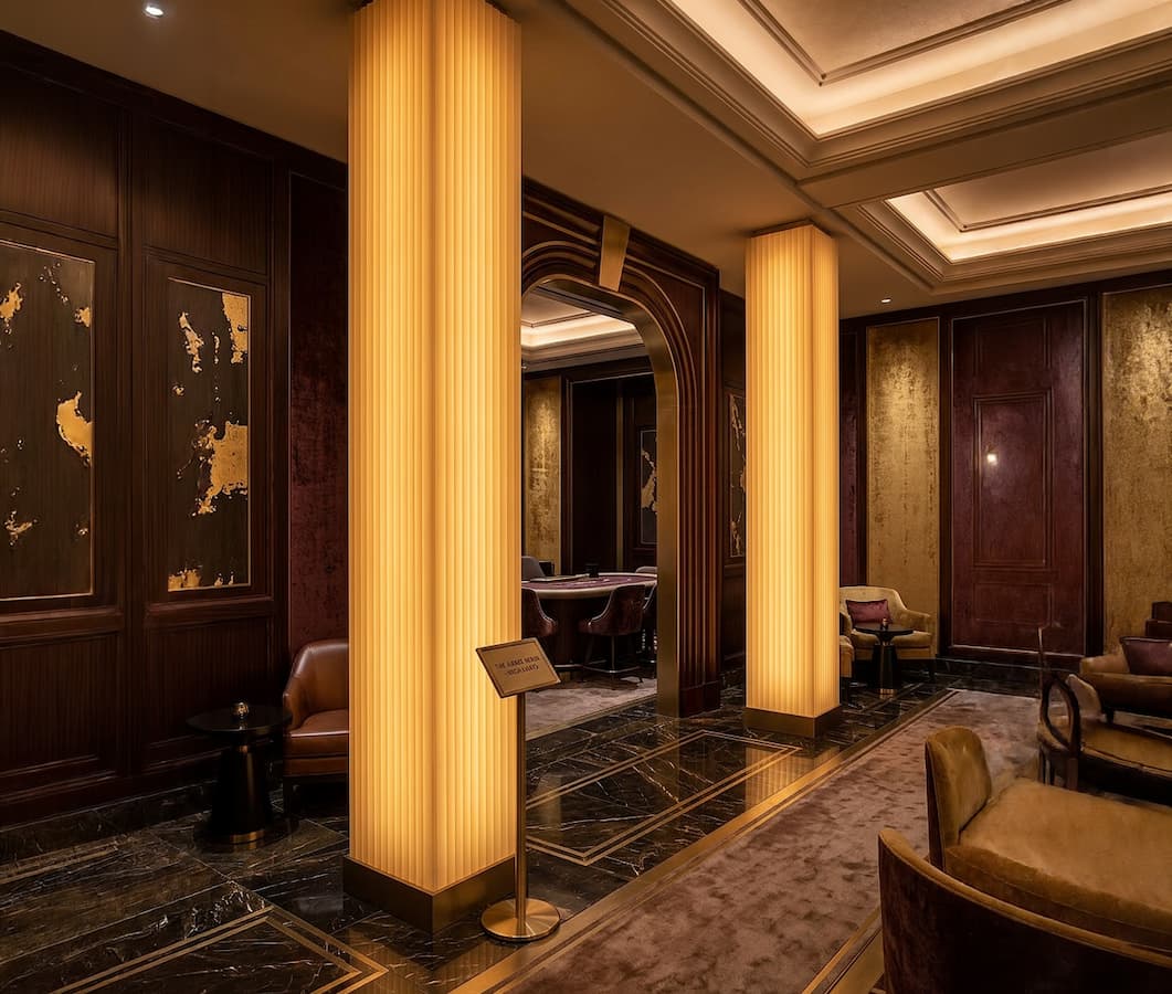 Rectangular columns carved with a linear design, backlit with warm lighting