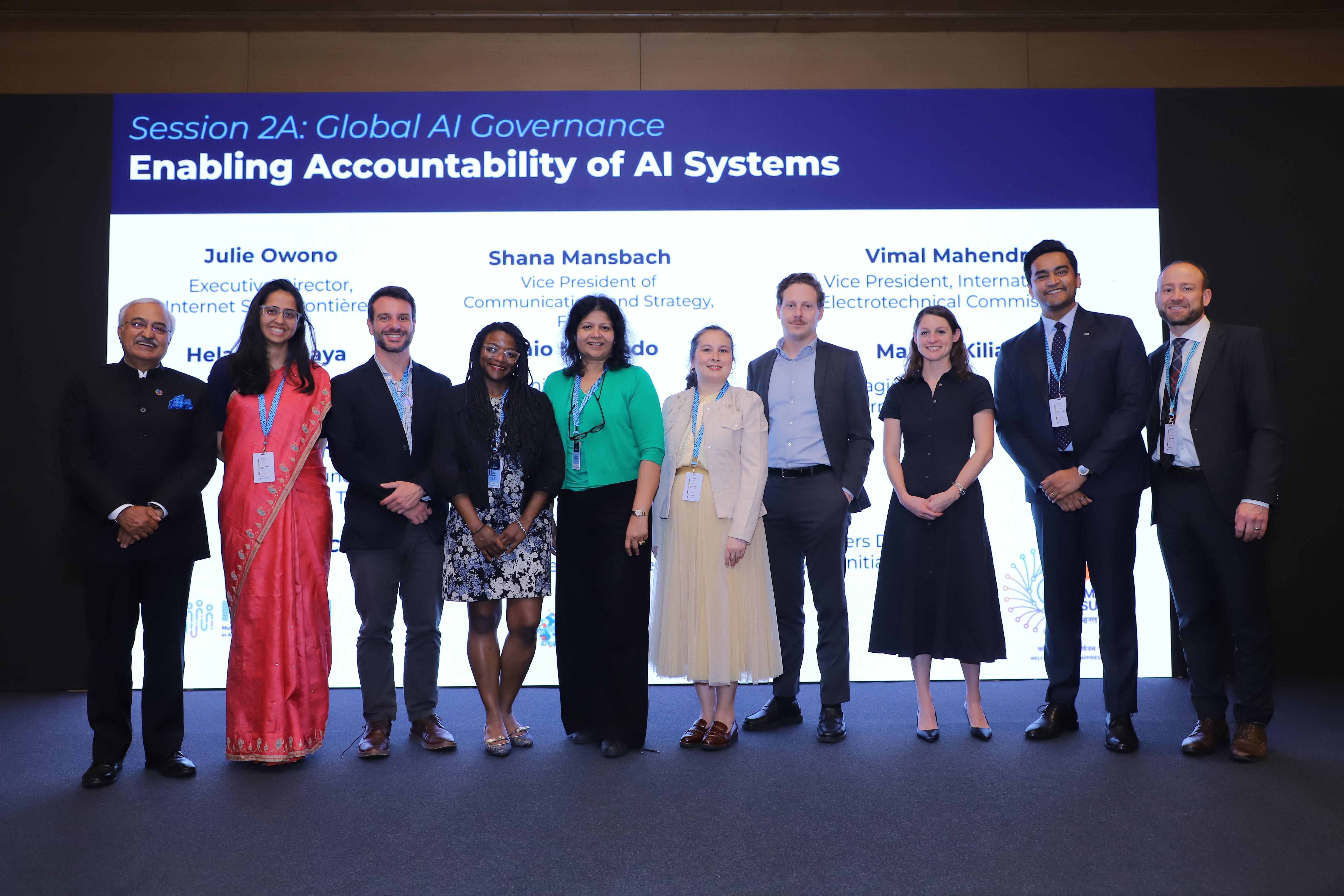 man in gray dress shirt holding black camera