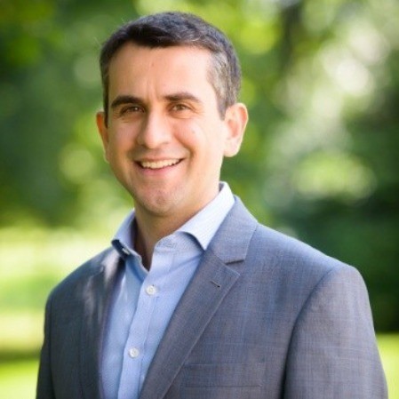 woman in black long sleeve shirt sitting on white couch