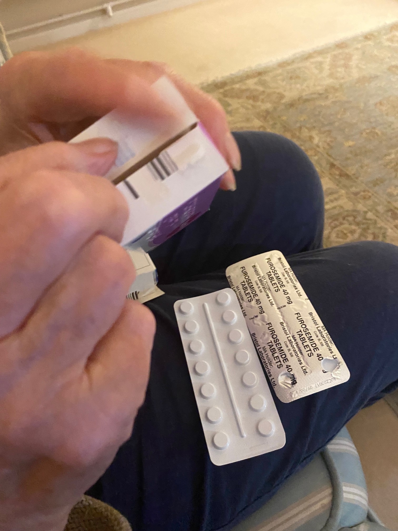 Elderly person opening pill packet 2.