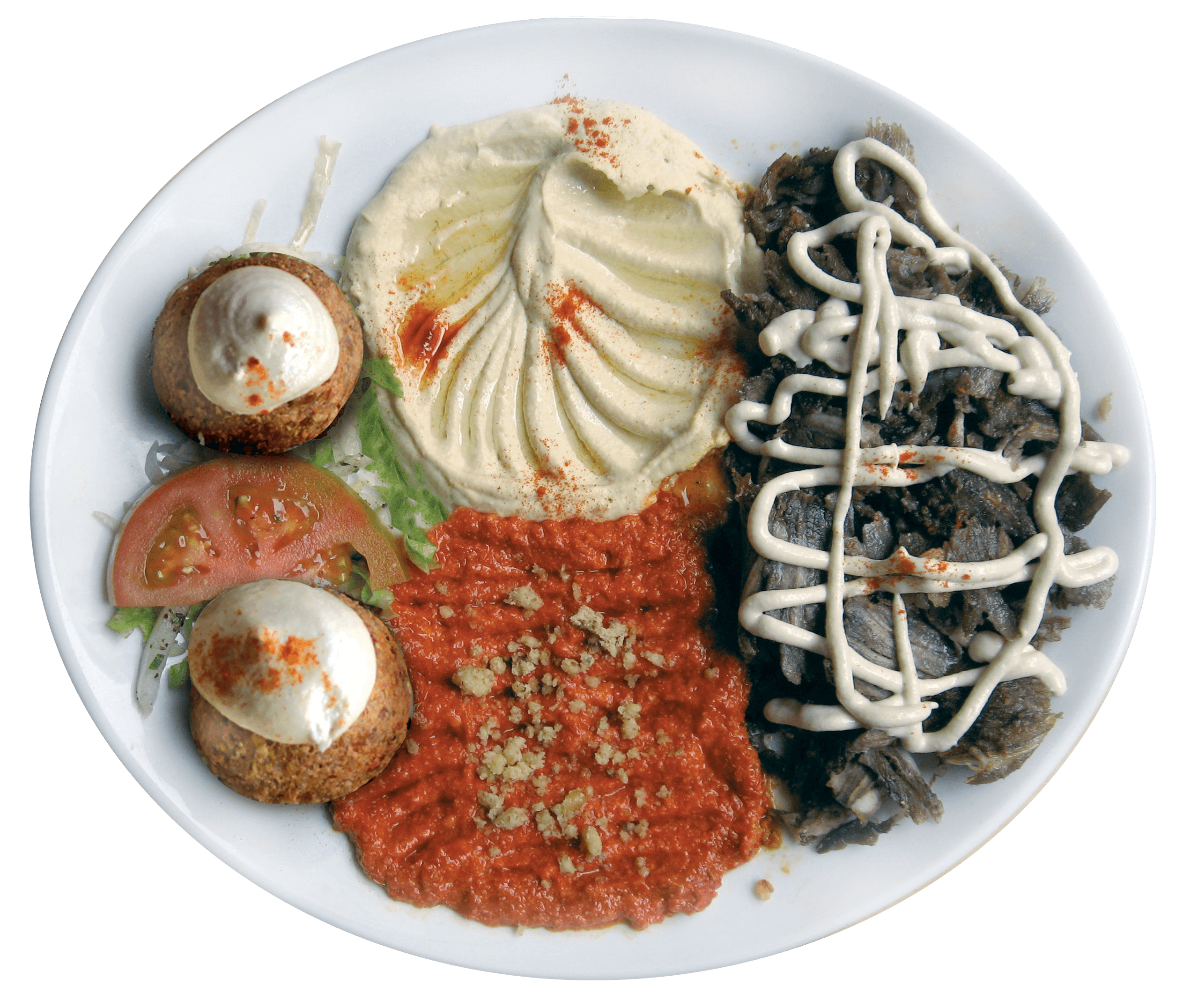 Chef preparing a dish at a rustic wooden table with fresh ingredients.