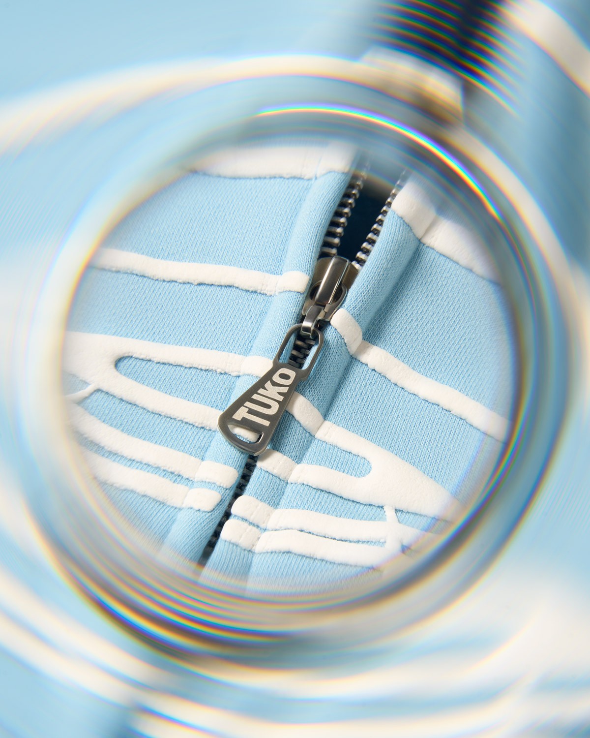 Tuko Clothing blue Dandadan inspired tracksuit detail shot photographer by Matthew Brown (London product photographer).