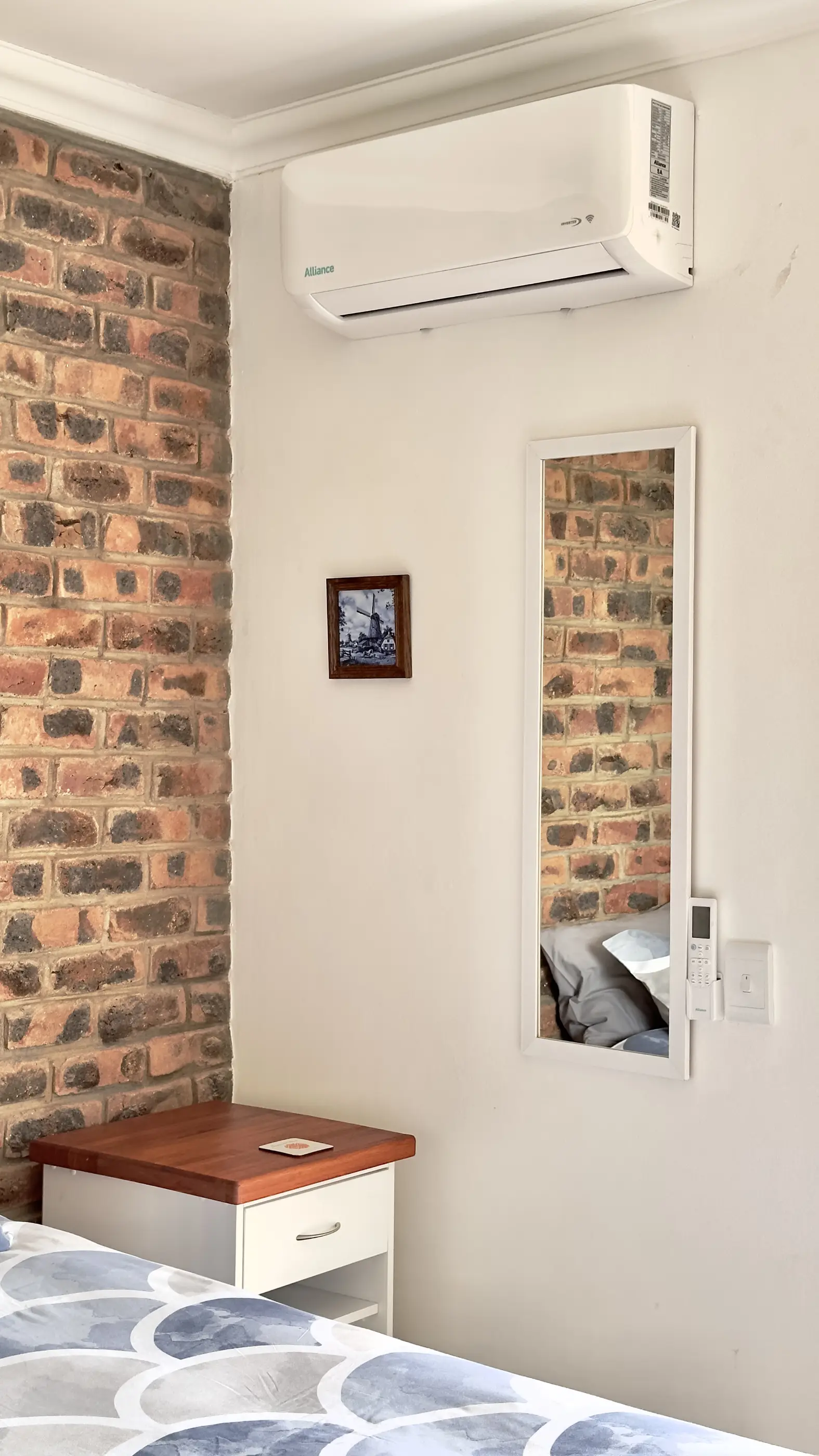 Mirror and bedside table in our A View Twenty-Four 7 room.