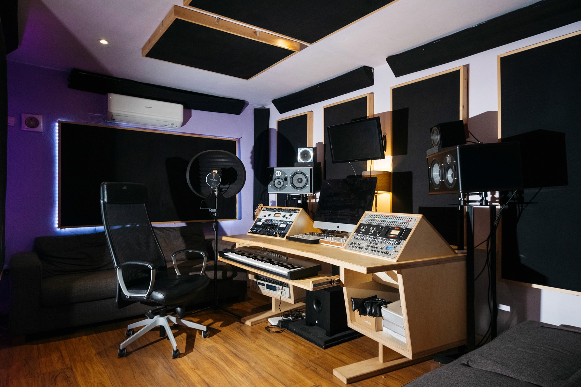 Root 73 studio room with mixing desk and recording equipment.