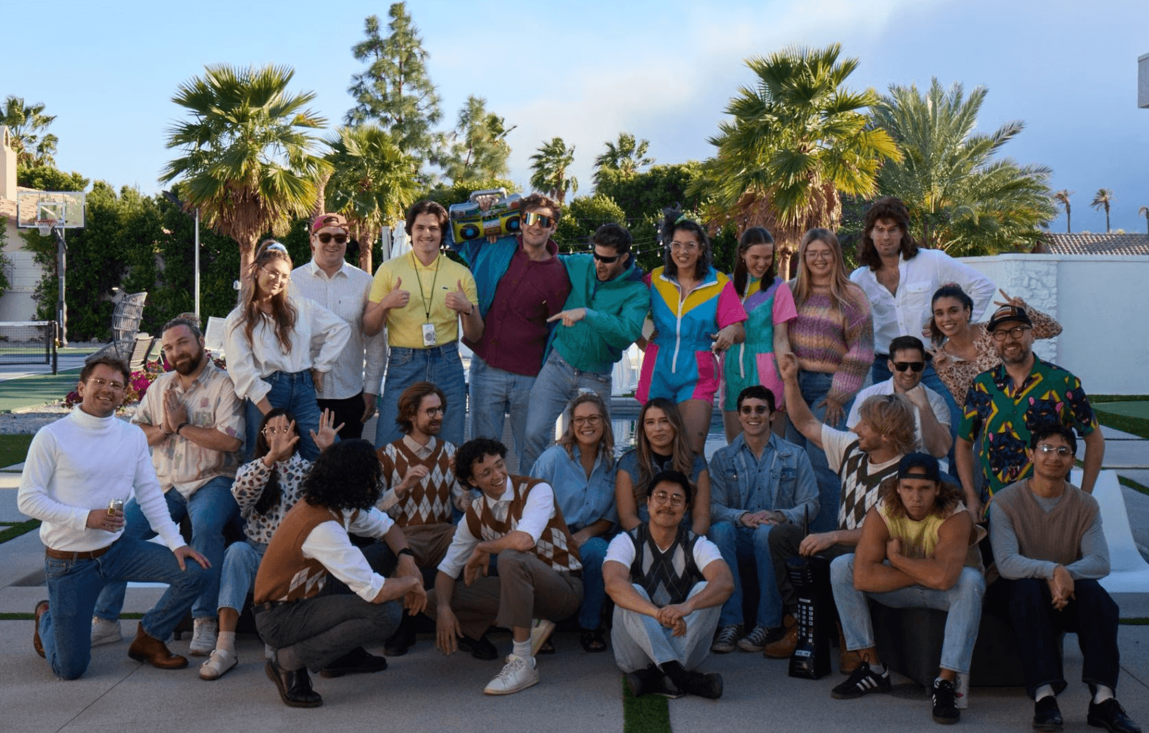 Black and white portrait of a smiling person with curly hair