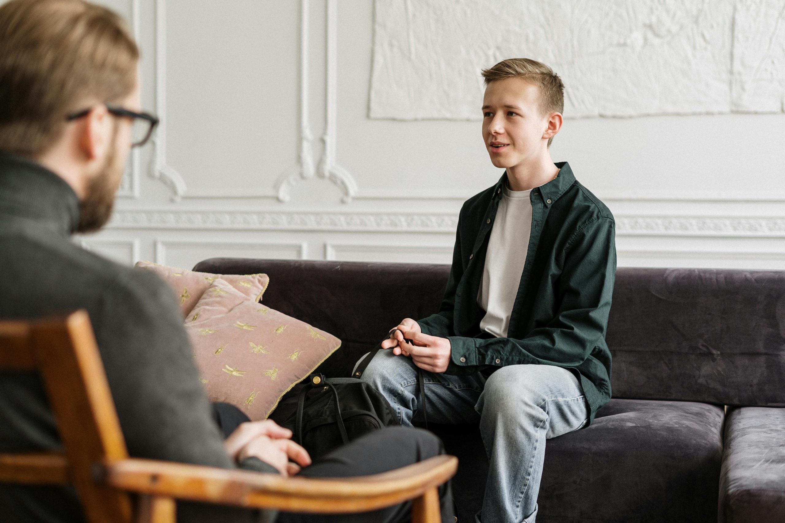 teenager discussing feelings during counseling session