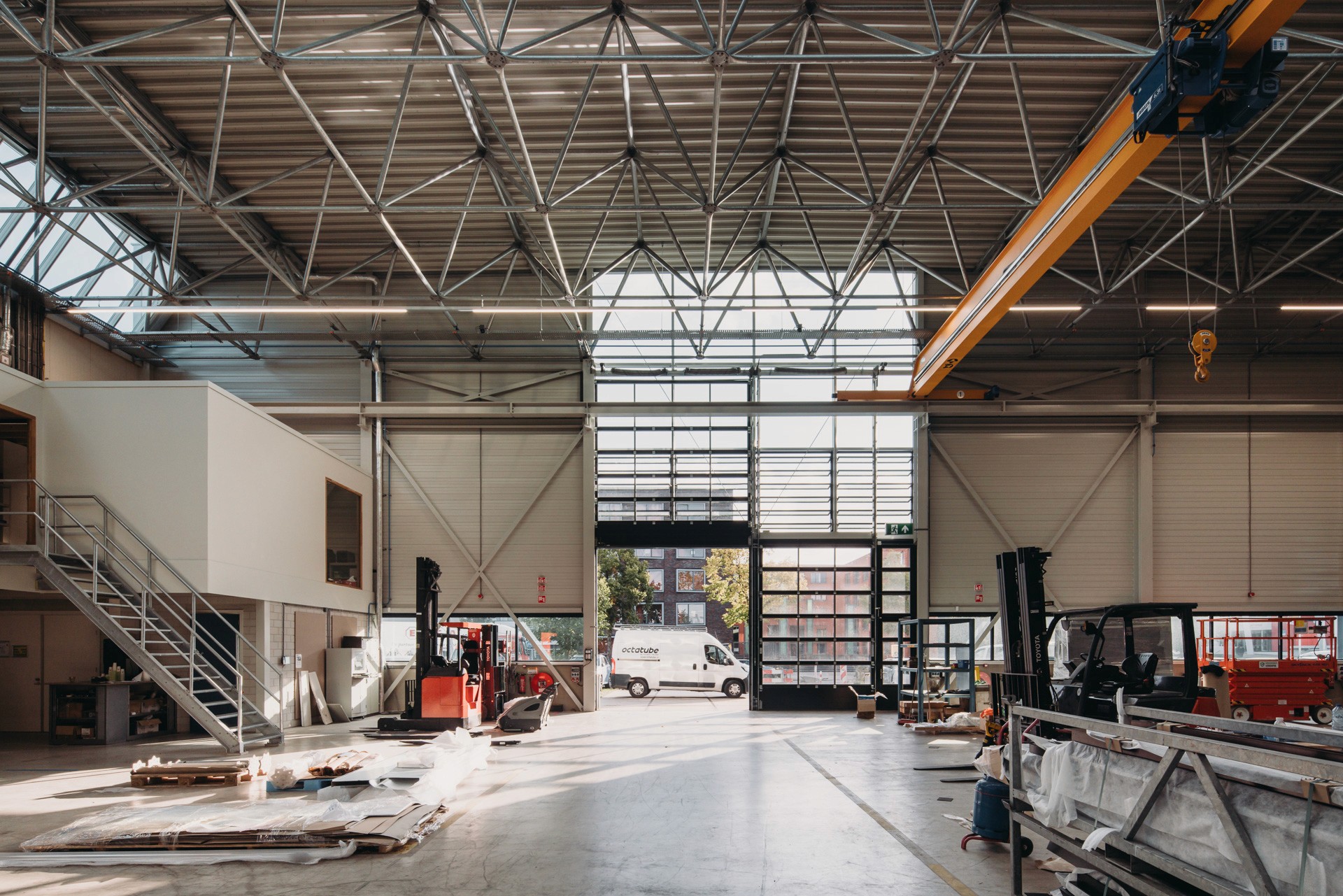 Interior photo of the main production hall, looking towards the entrace for trucks
