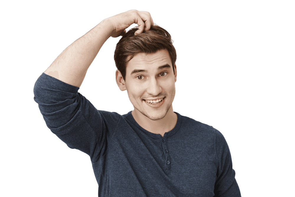 Man with thick natural hair smiling after successful hair transplant procedure.