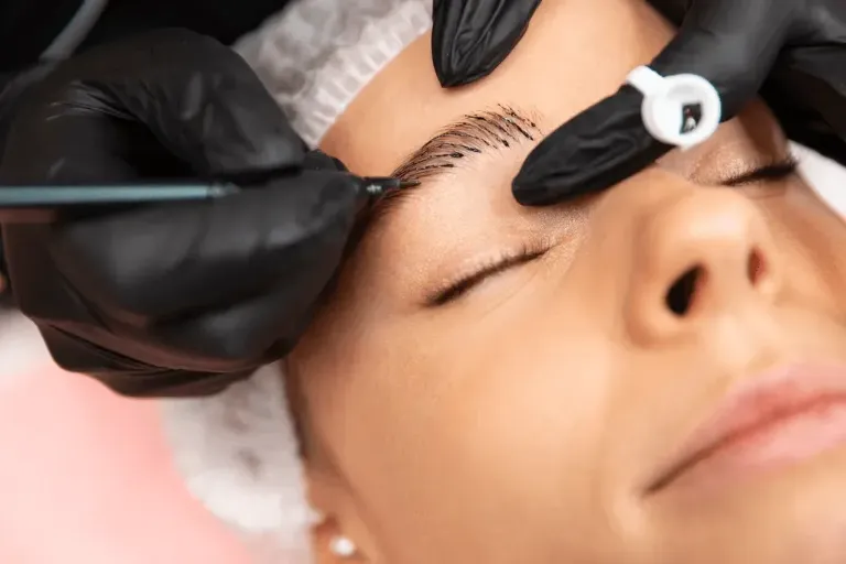 Client receiving microblading at Pretty in Ink, Buffalo NY permanent makeup studio
