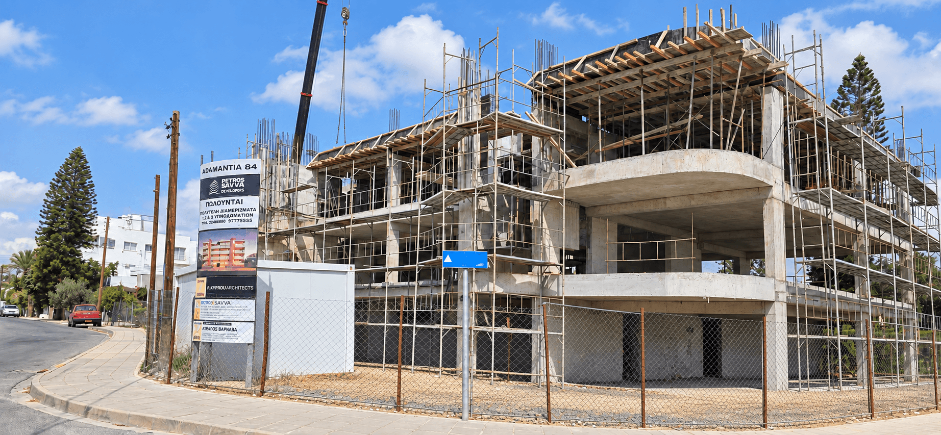 Lasithiou 19 under construction, with concrete balconies and scaffolding