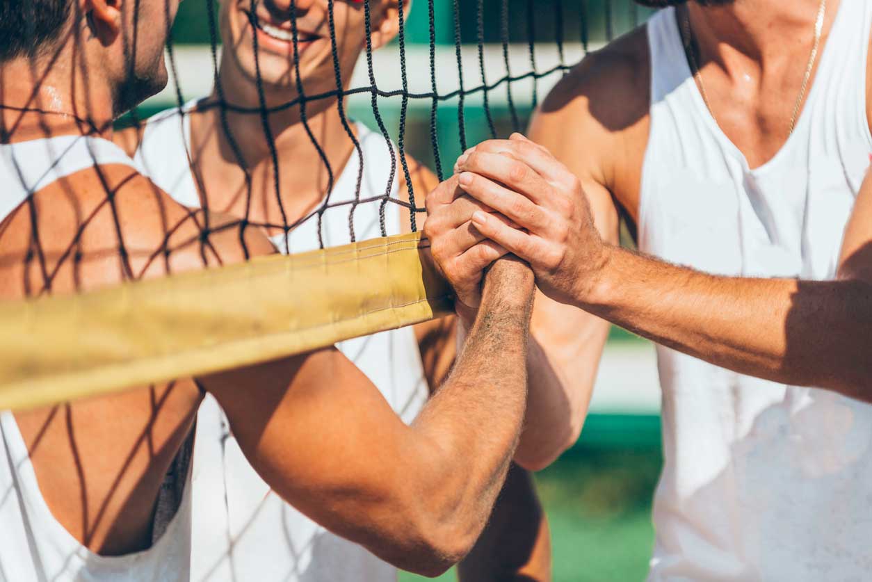 beach volleyball players shaking hands