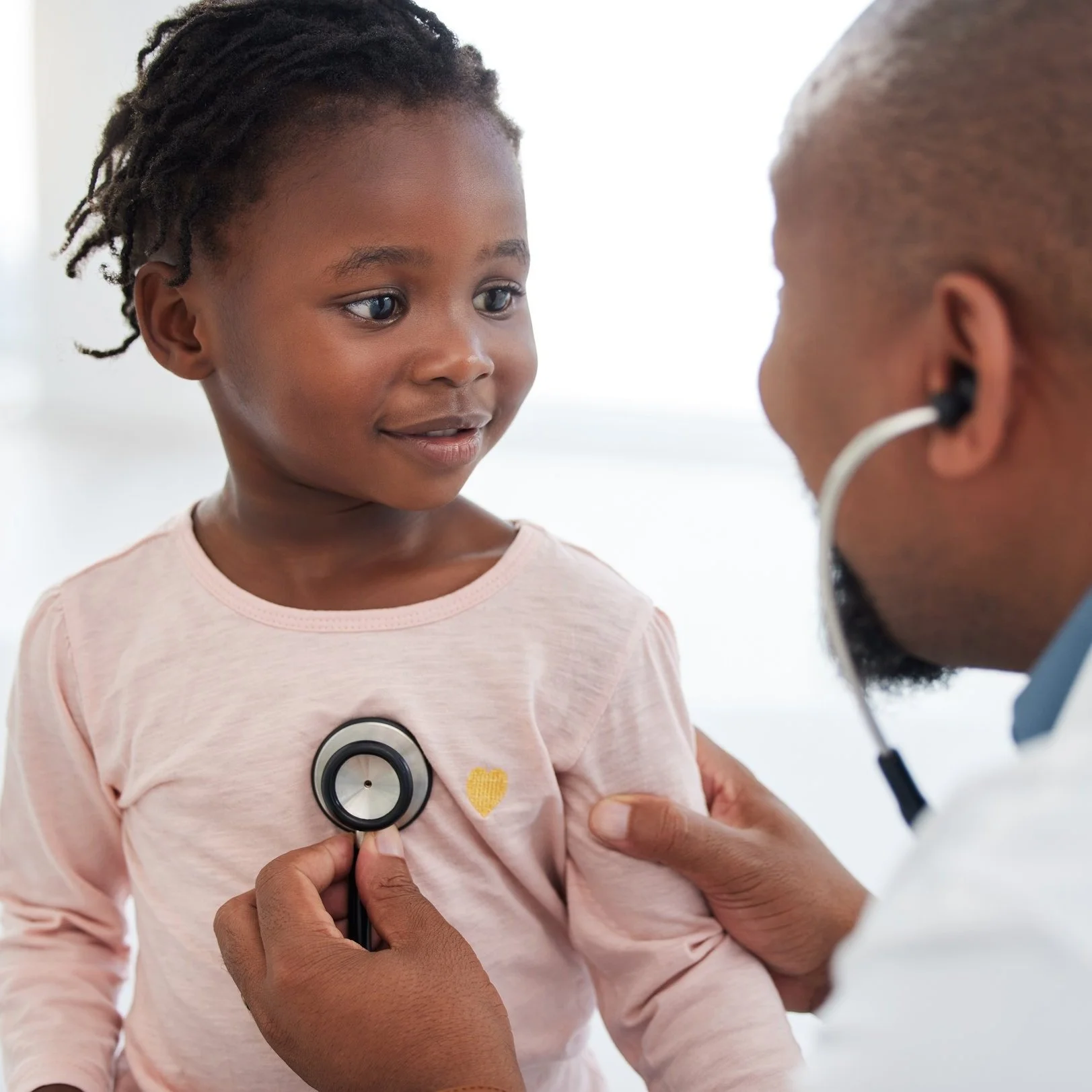 Doctor and patient holding hands after good news