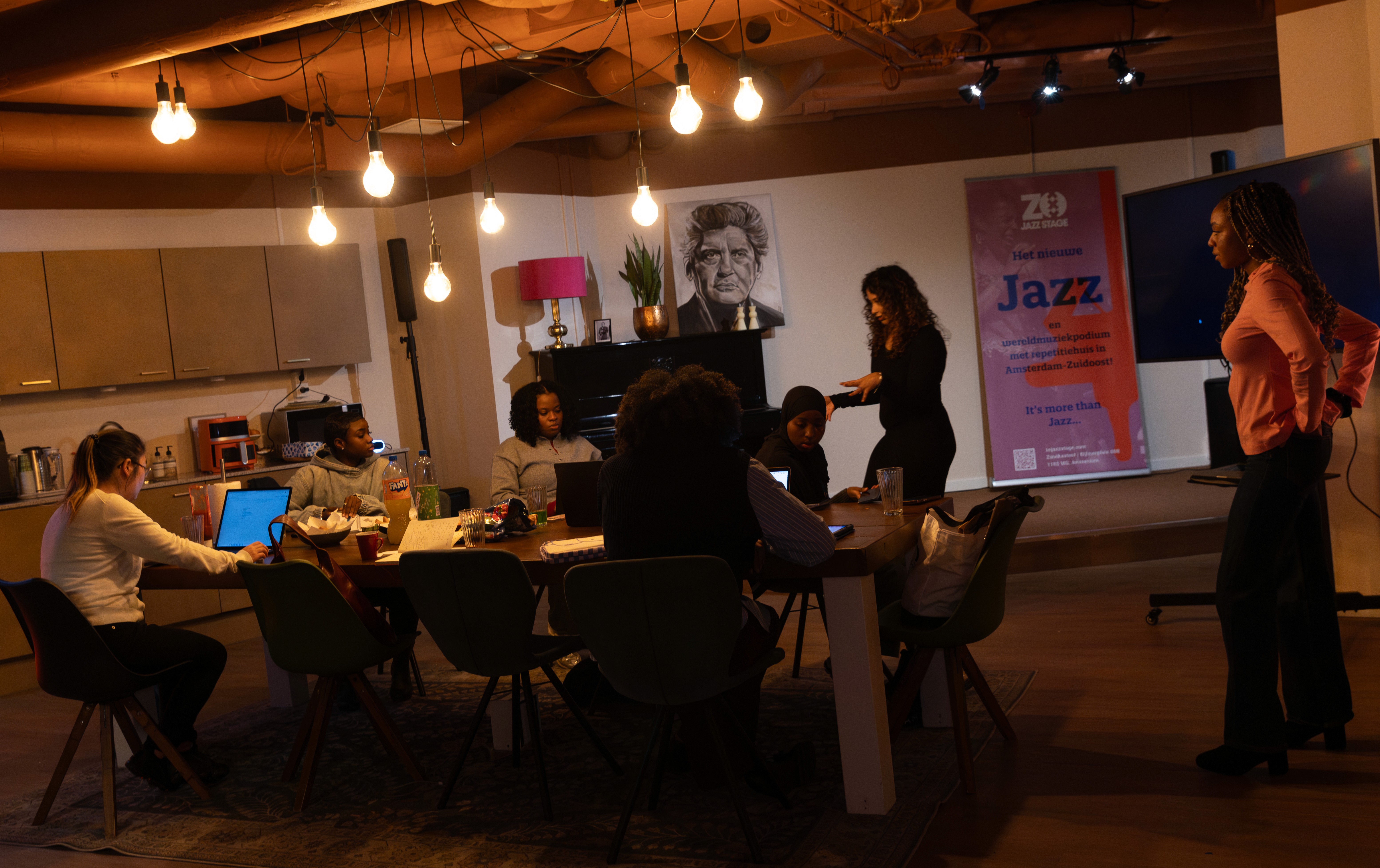 people sitting on chair in front of laptop computers