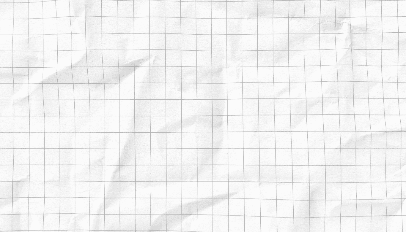 Vintage computer monitor and keyboard on a desk.