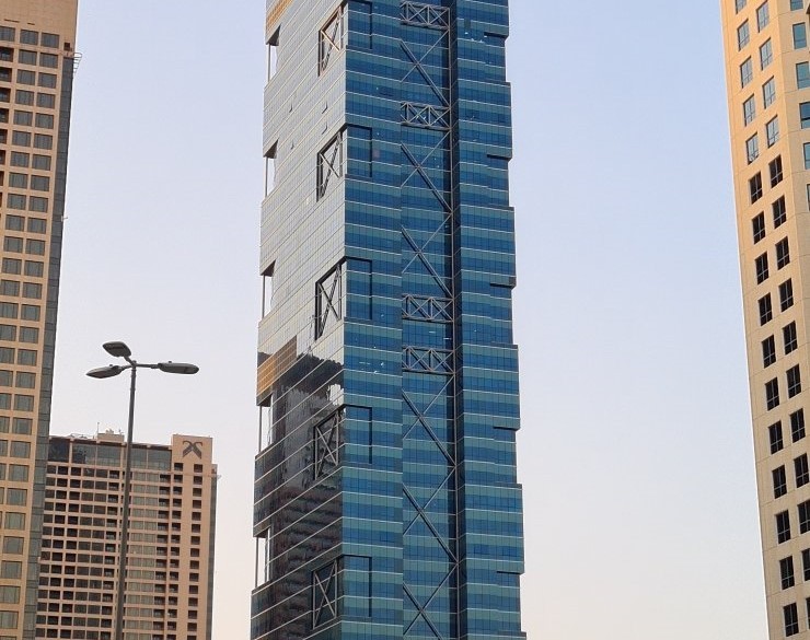 Sleek architectural design of a high-rise tower, ideal for businesses seeking premium office rentals.