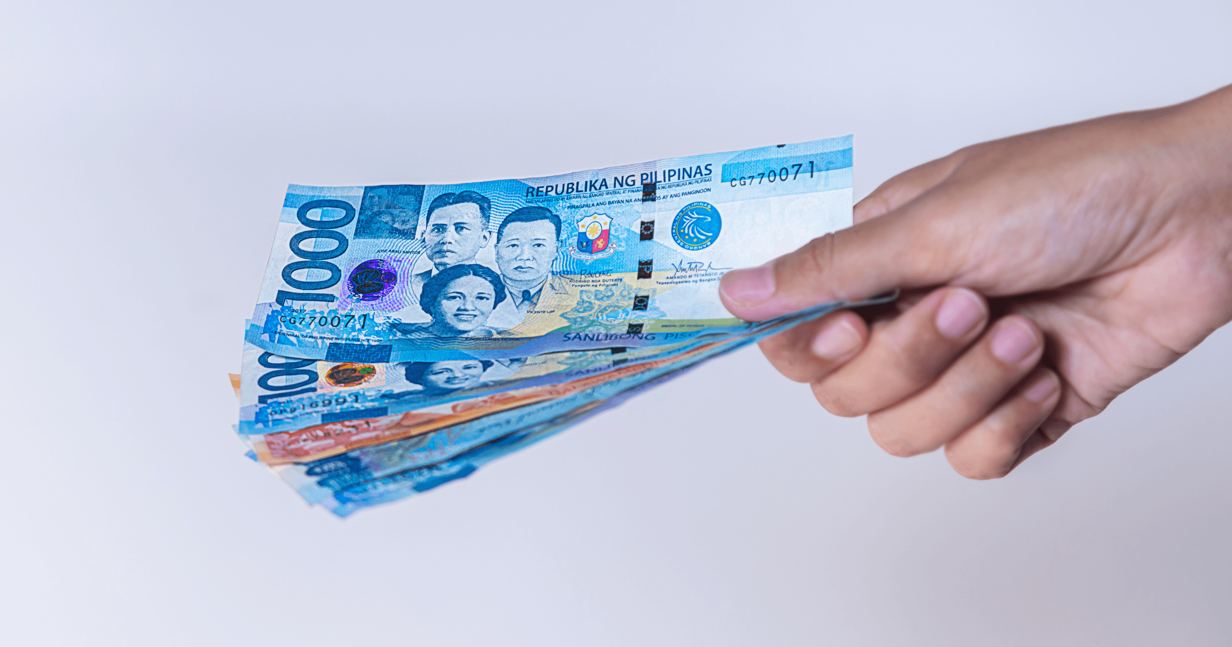 A Filipino business owner counting money