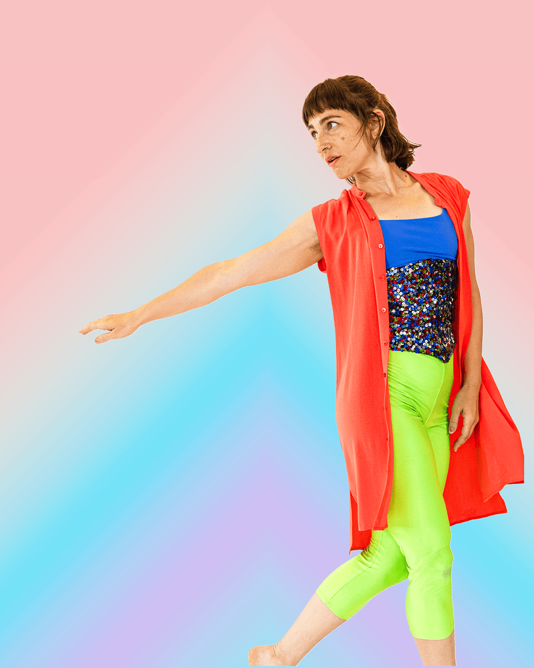A circular studio portrait of dancer Non Edwards reaching upward gracefully mid-movement against a clear blue backdrop.