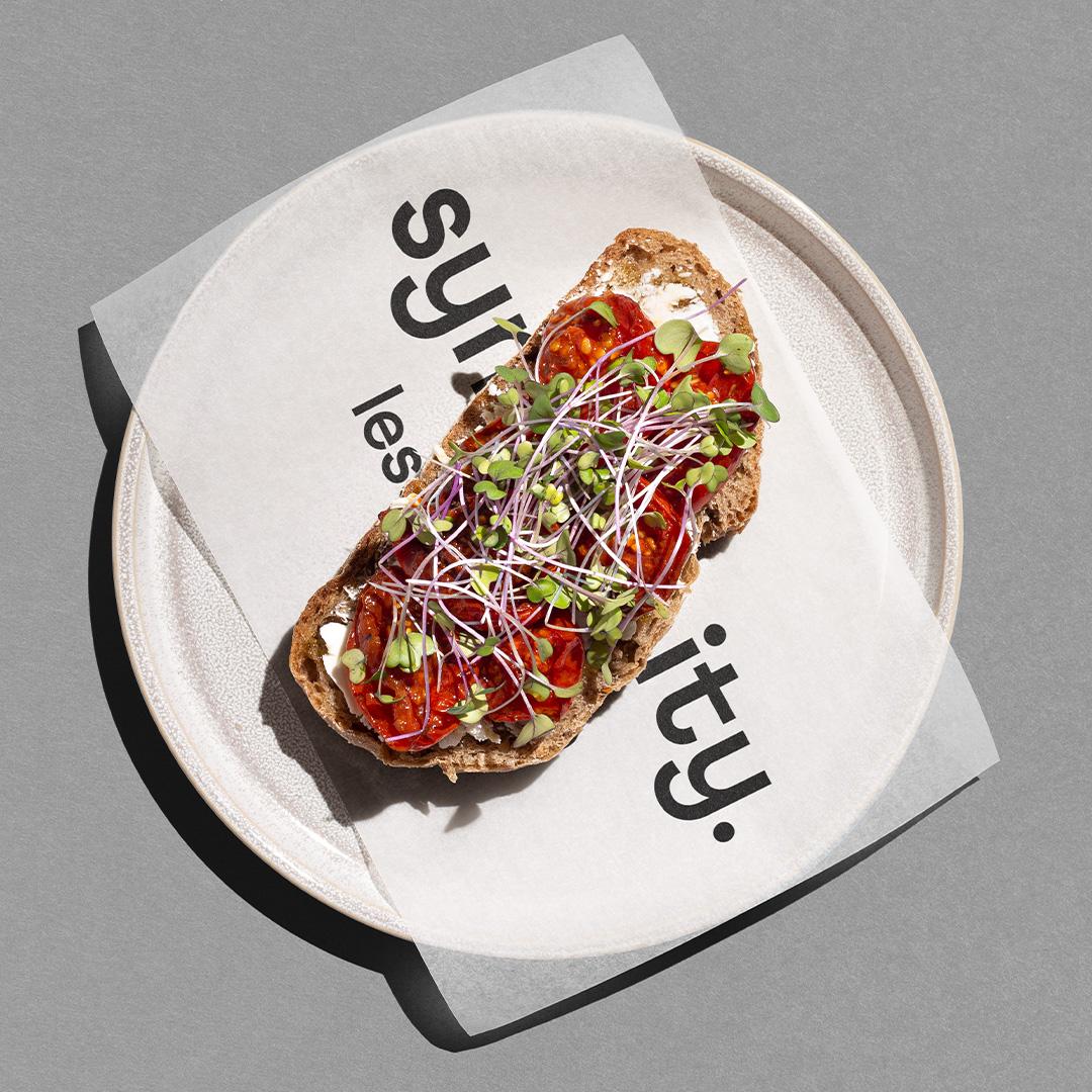 tipota design studio -symplicity sauce on a bistro plate. symplicity branding on paper wrap — symplicity branding