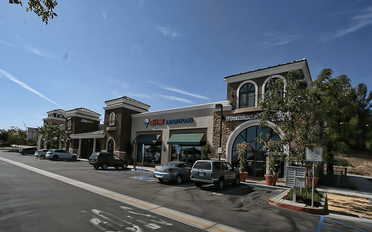 Exterior view of the mall with the parking lot, showcasing the unique design features.