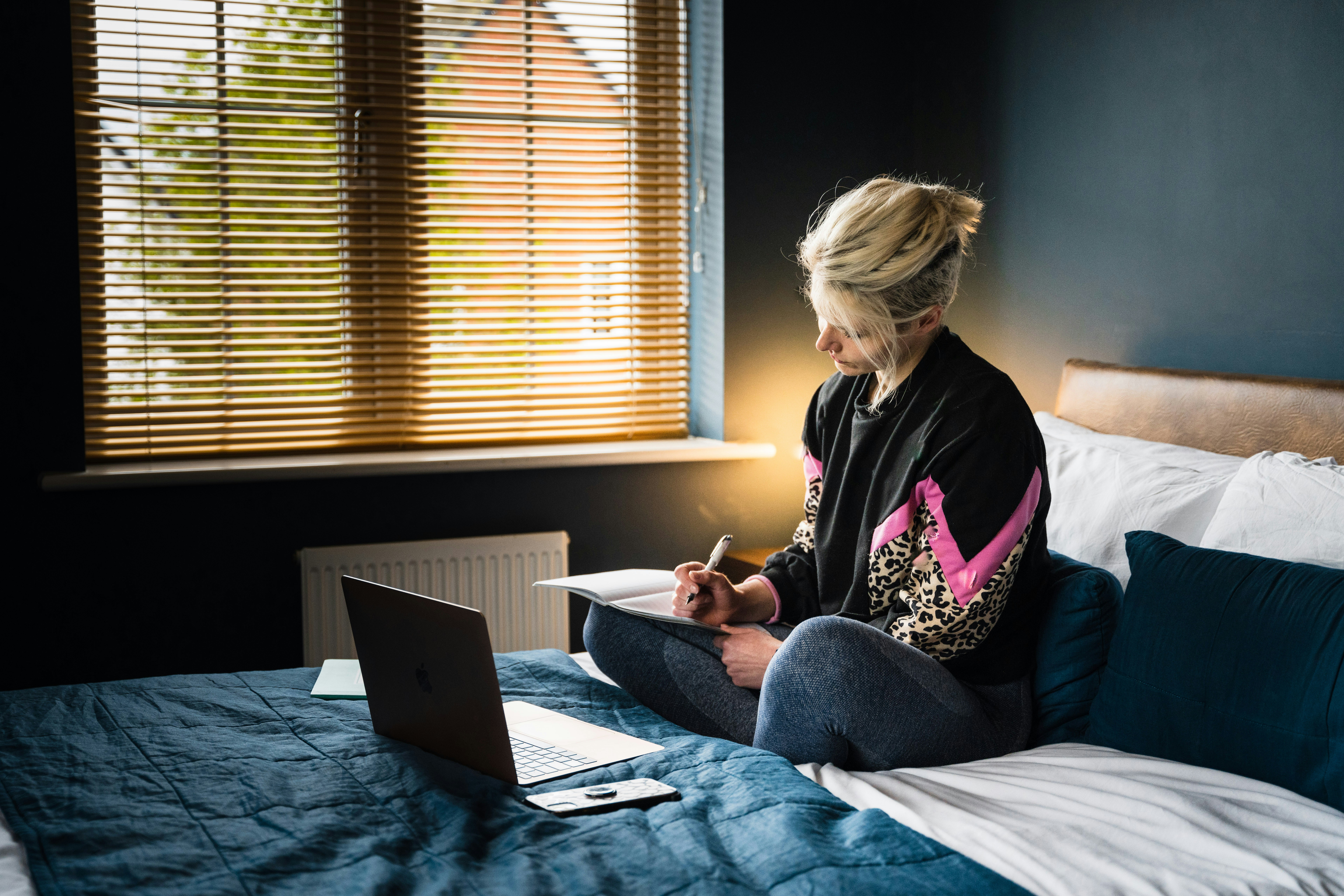 woman making notes - How Is AI Detected In Writing? 