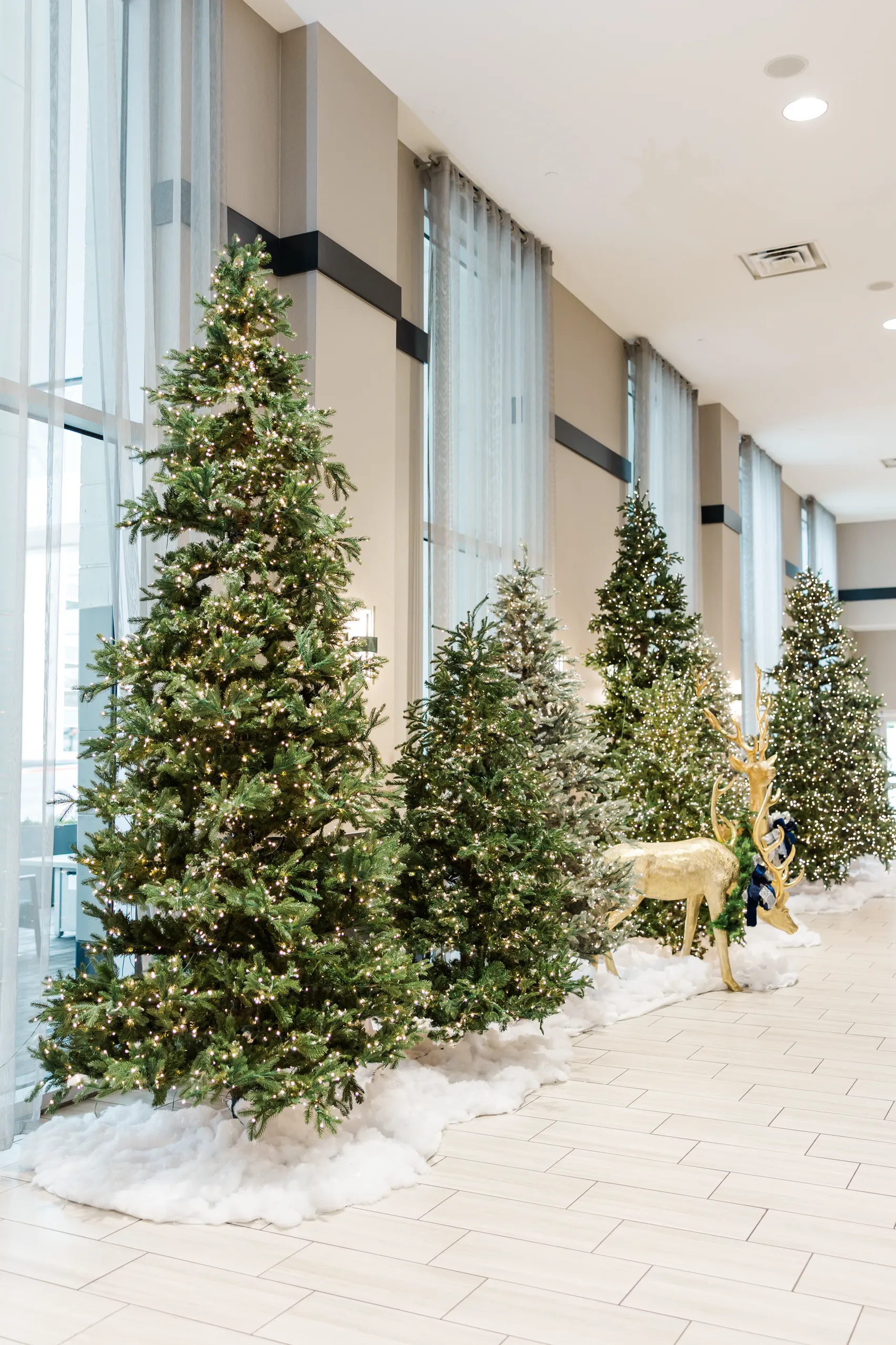 Luxury table setting by Sarah Overall Events with pink embroidered napkins, gold-rimmed plates, floral arrangements, and personalized menus in Shreveport.