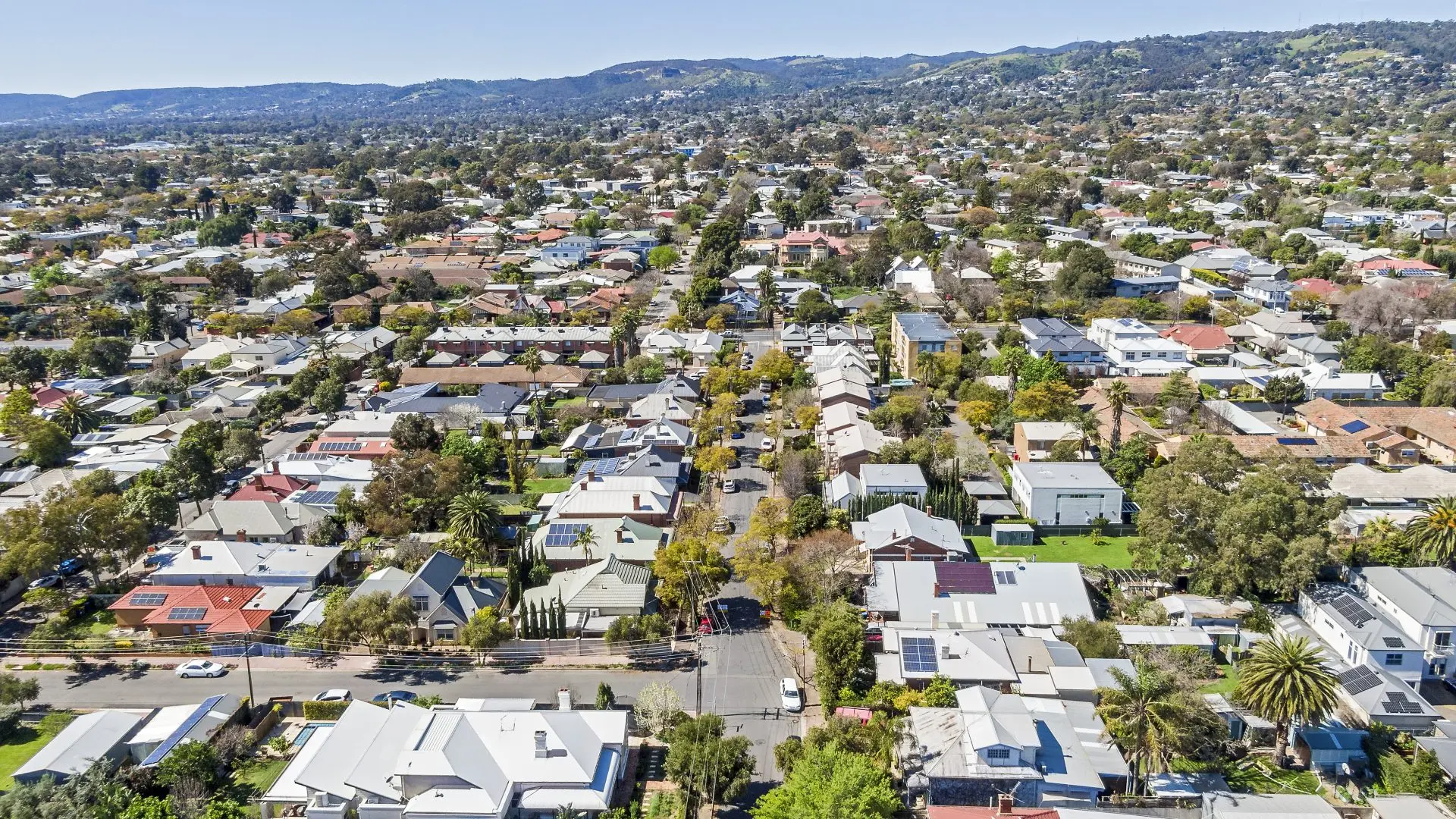 Aerial view of a suburban neighborhood with houses and trees.