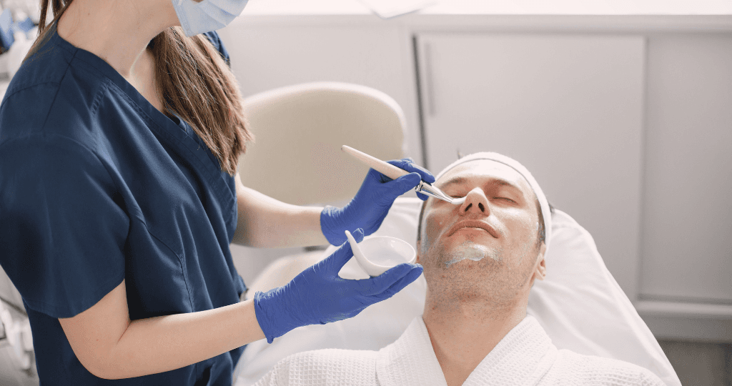 Dermatologist applying a facial treatment, showcasing simplified billing for clinics