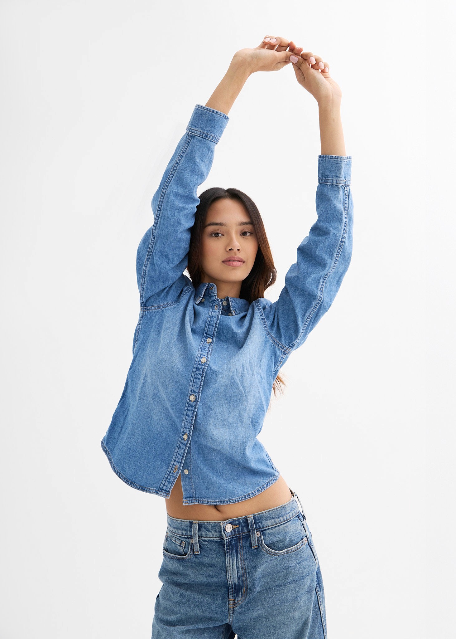 Sunlight streams through an arched window onto a ledge.