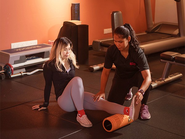 Personal Training In Kuala Lumpur, Woman having a recovery session with a female coach in a women's only private training room