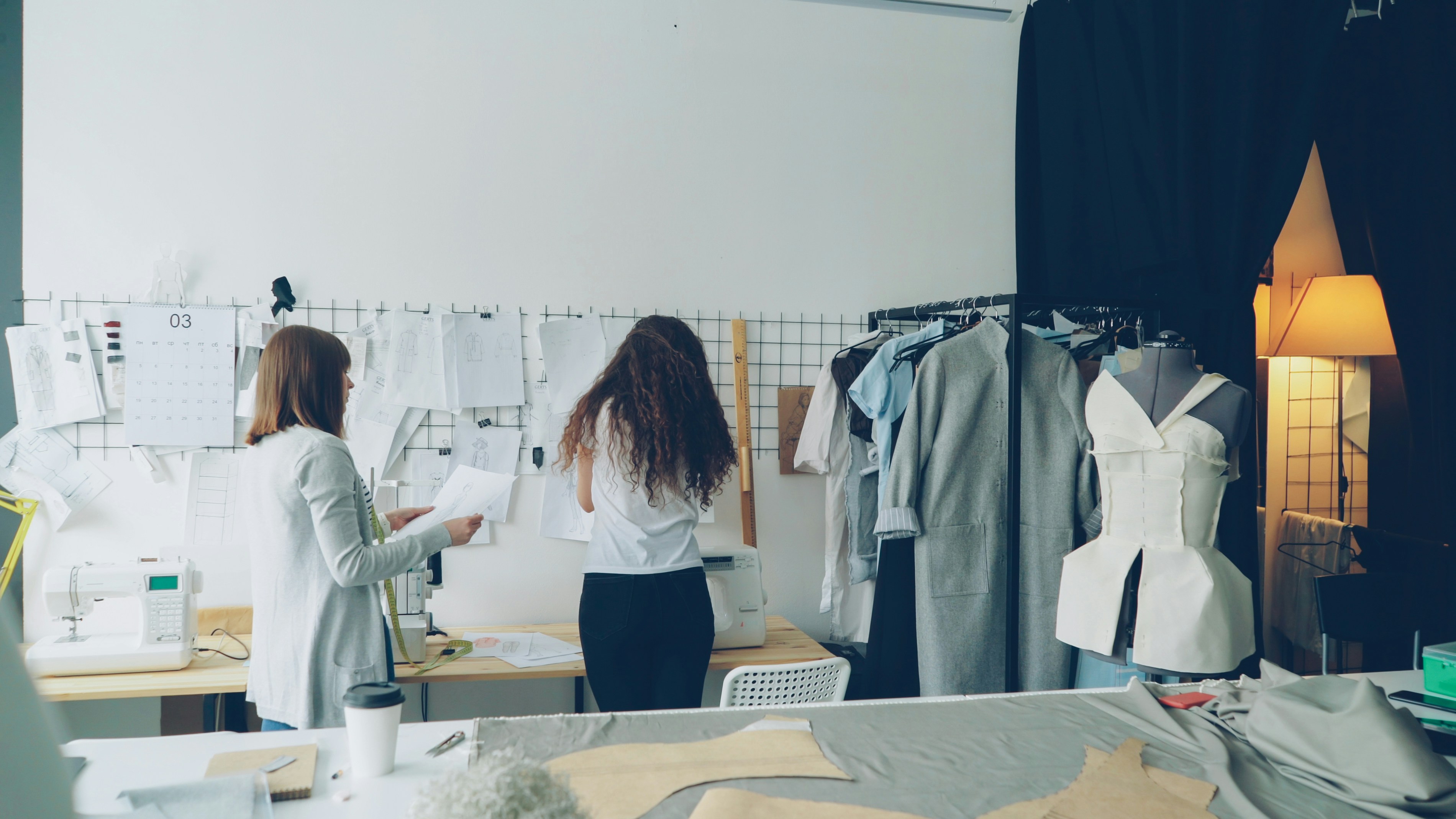 Designers collaborate in a fashion studio.