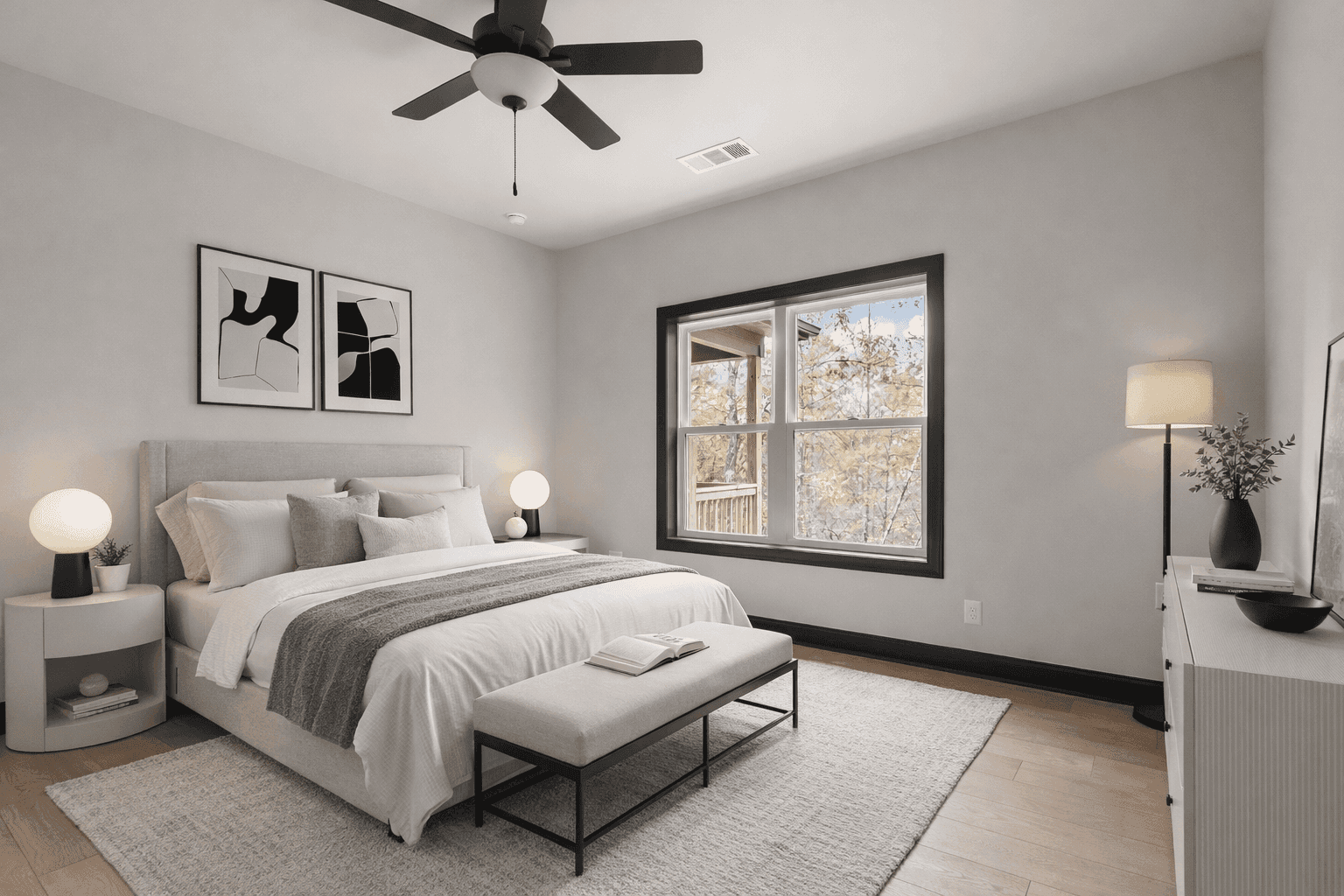 Open concept kitchen and living room with vaulted ceilings and hardwood floors