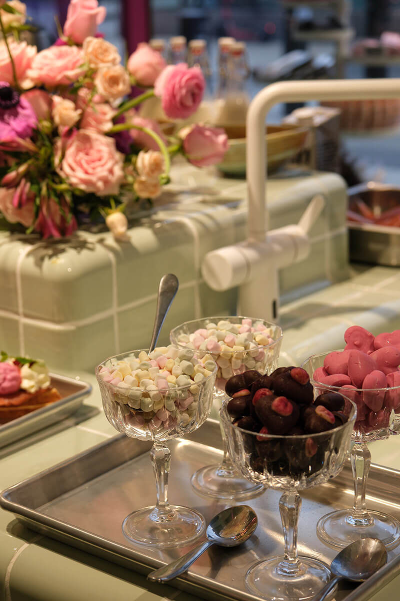 Several dishes placed together on a table with flowers