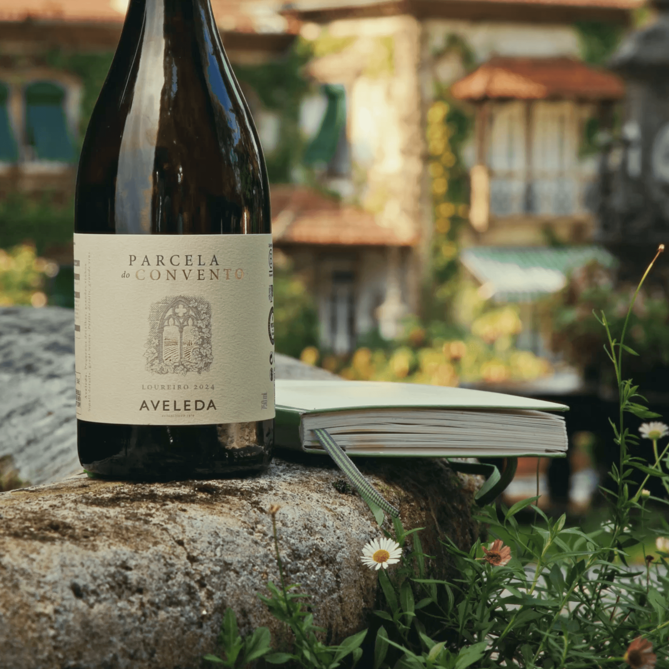 Close-up of a device with two black lenses glowing orange and a small green light