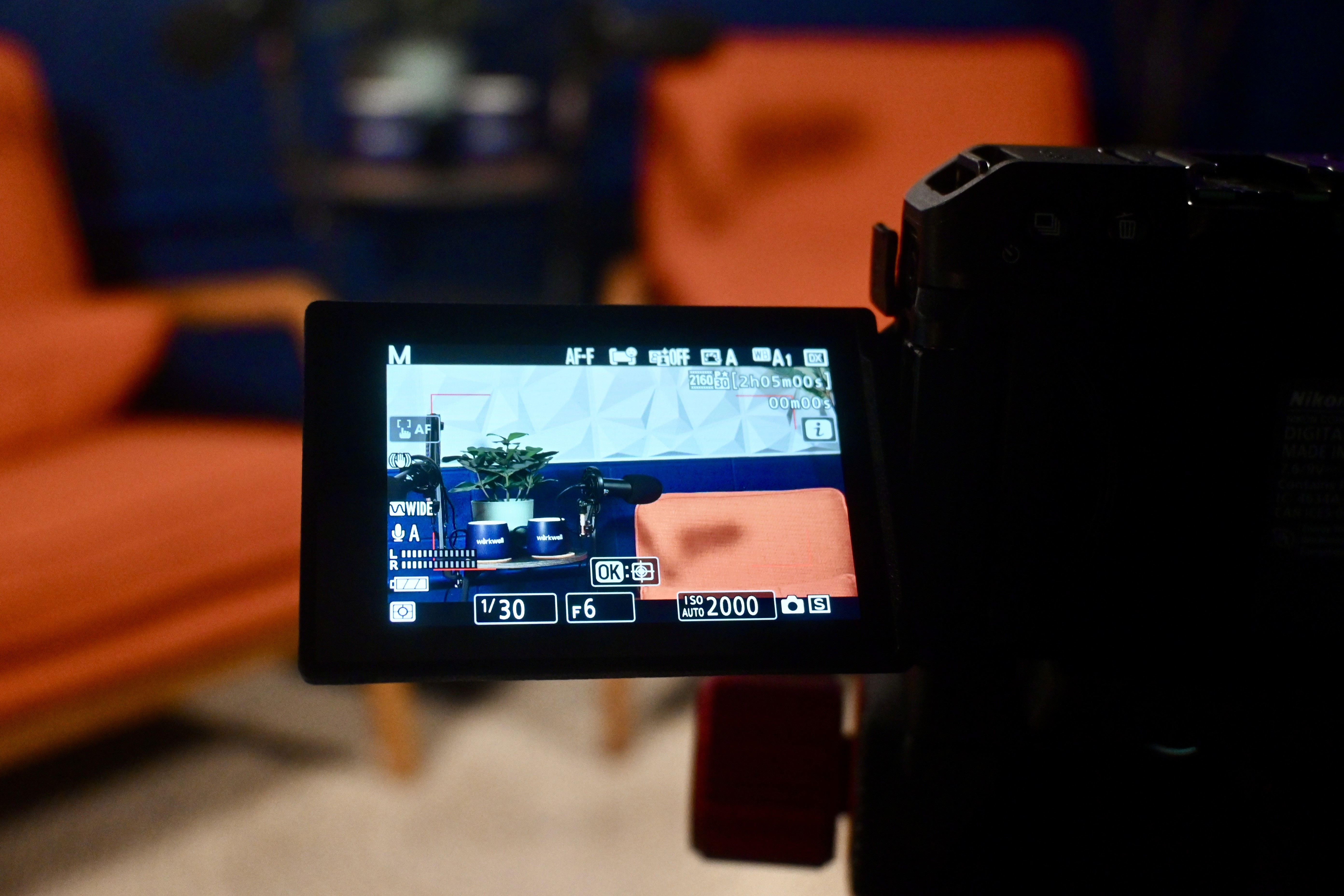 a video camera filming a podcast studio