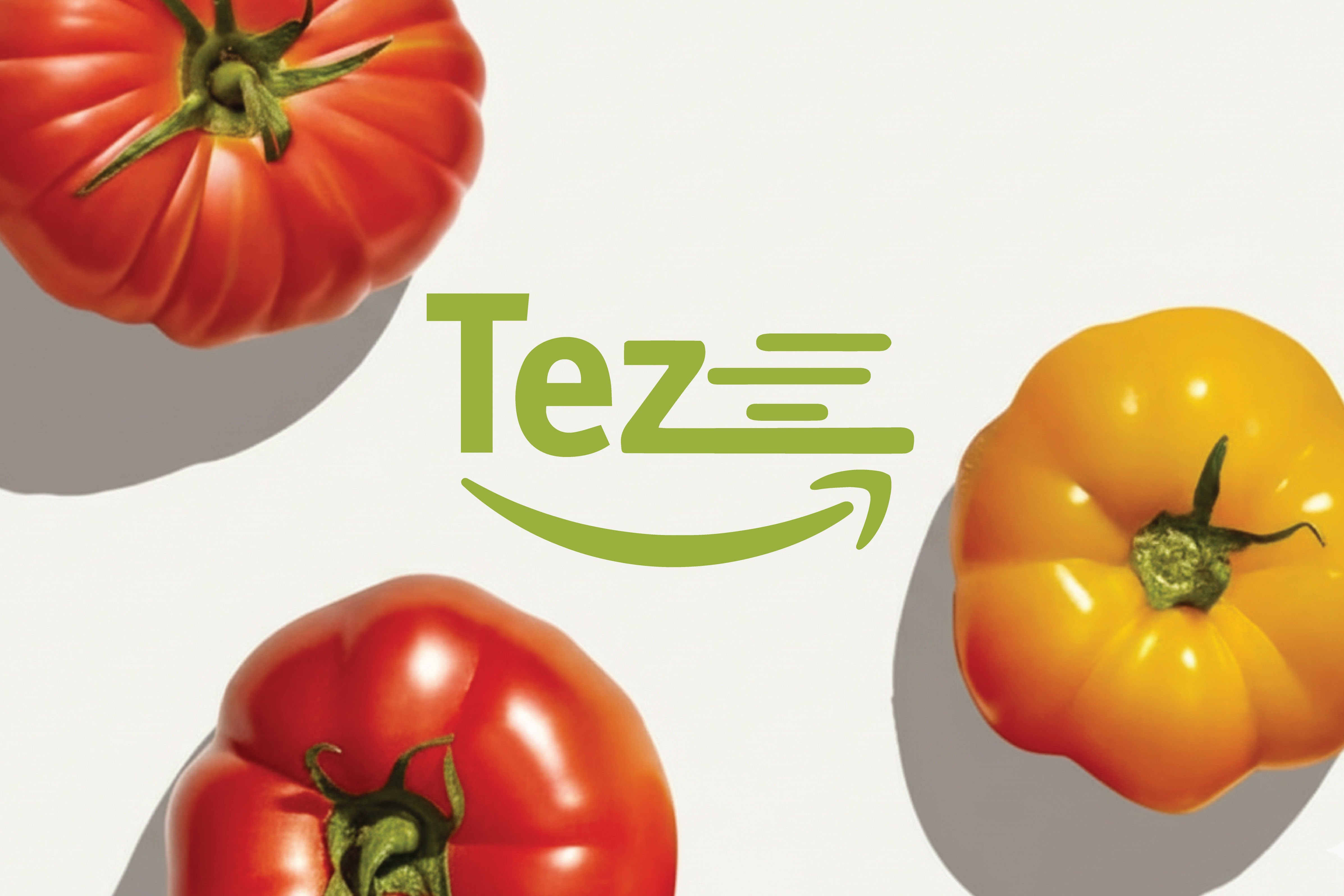 White branded cap with turquoise logo placed on fresh lemons in a red bowl